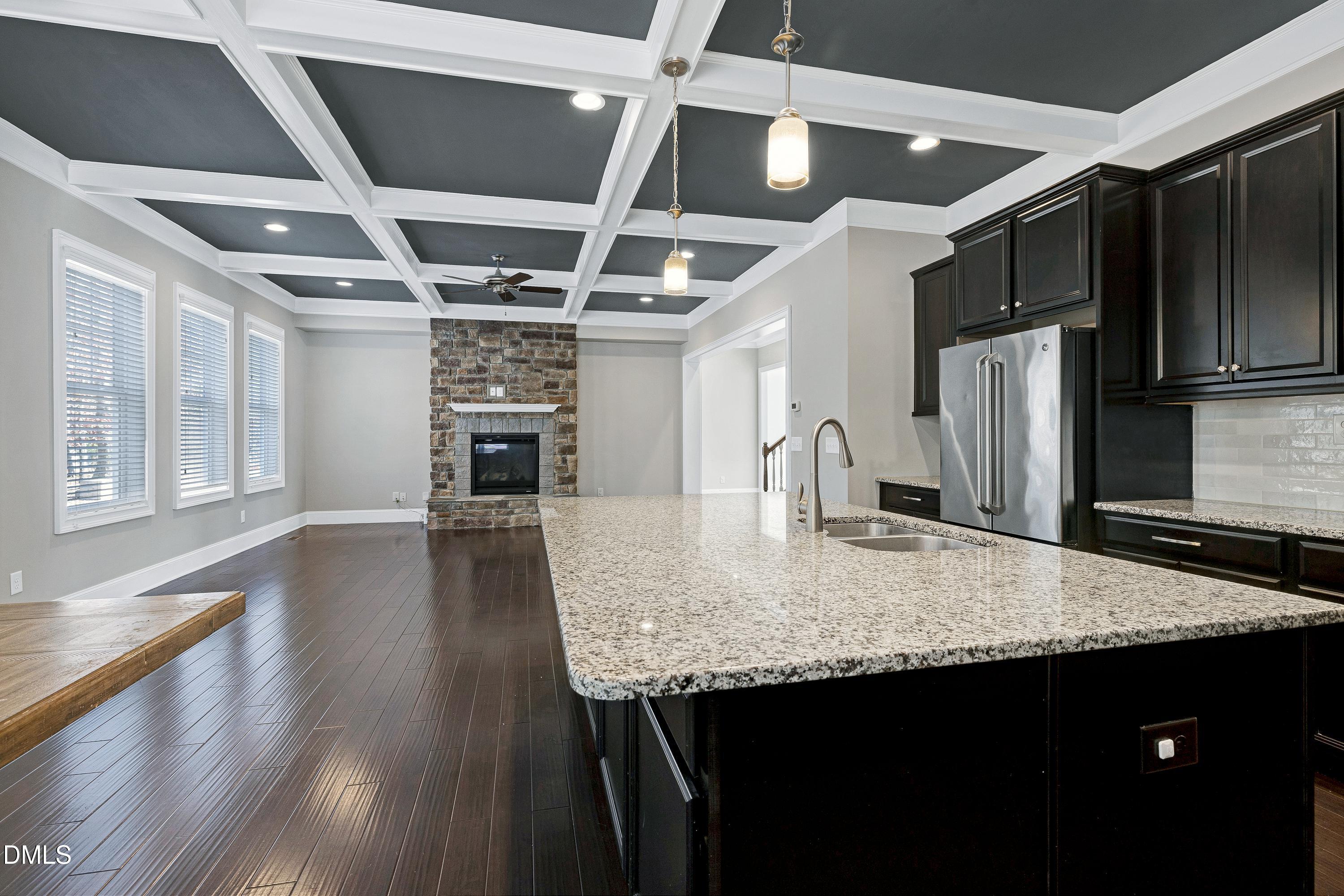 212 Mystic Pine Place Apex, NC 27539 - Photo 12 of 67 a kitchen with stainless steel appliances granite countertop a refrigerator a stove and a sink