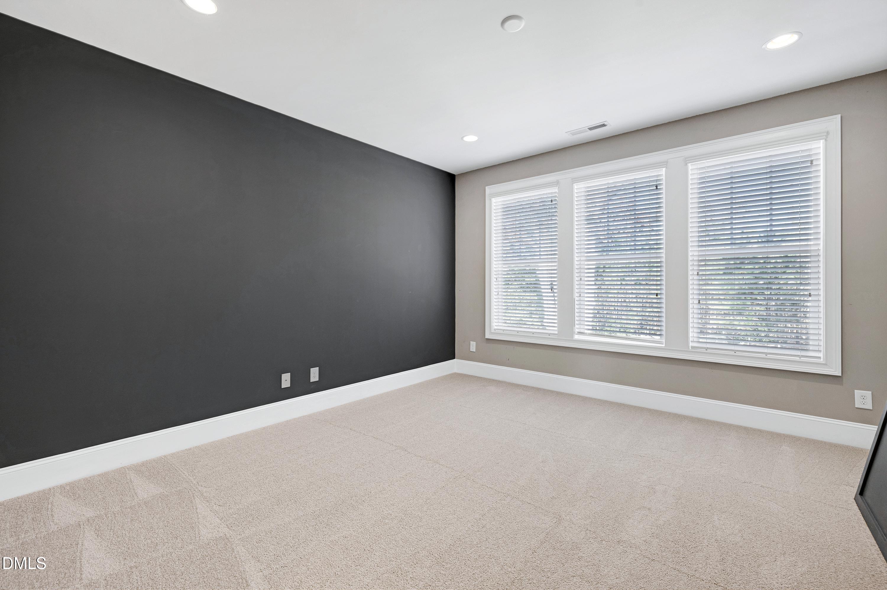 212 Mystic Pine Place Apex, NC 27539 - Photo 20 of 67 a view of an empty room with a window