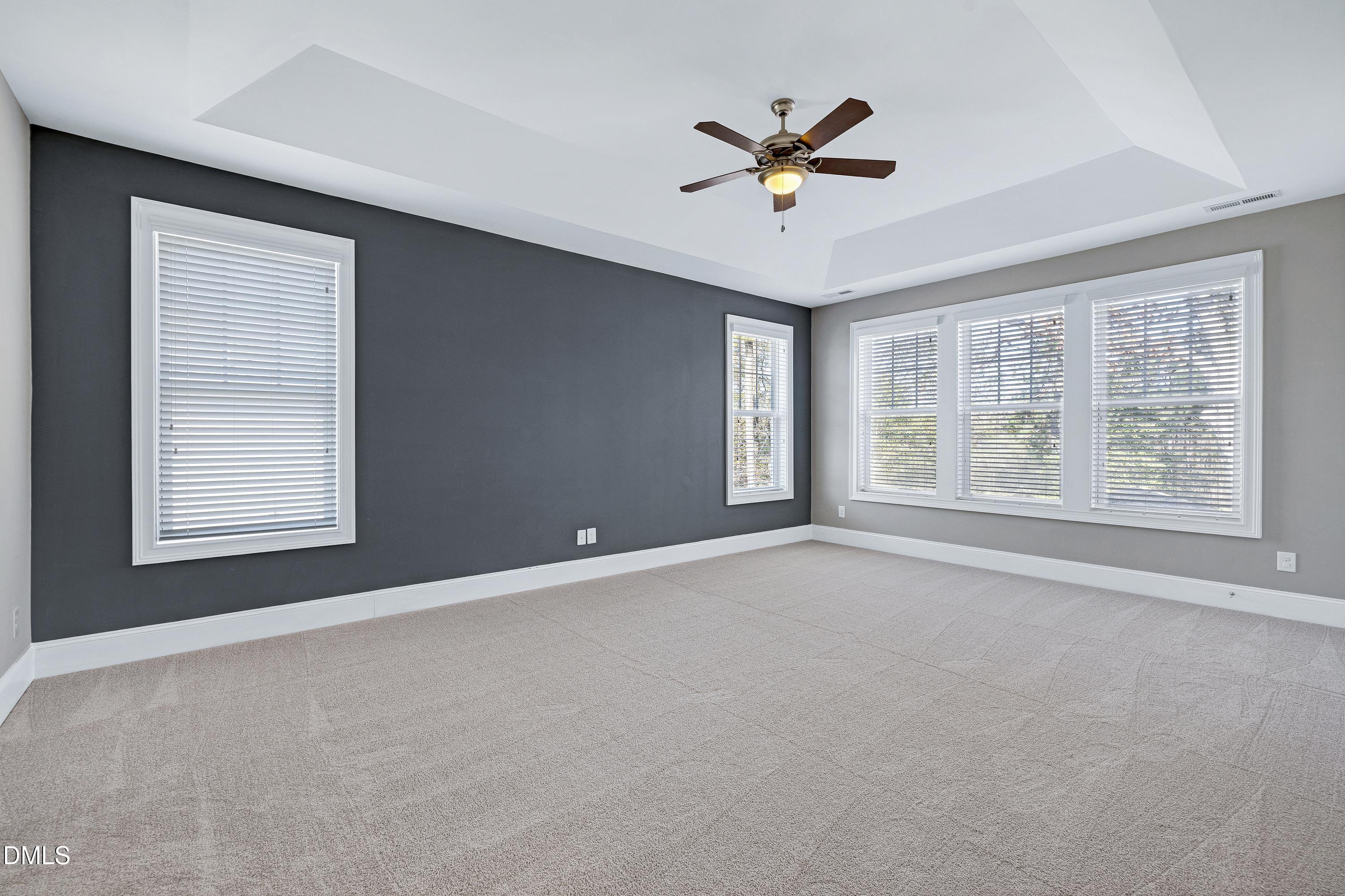 212 Mystic Pine Place Apex, NC 27539 - Photo 22 of 67 a view of an empty room with a window