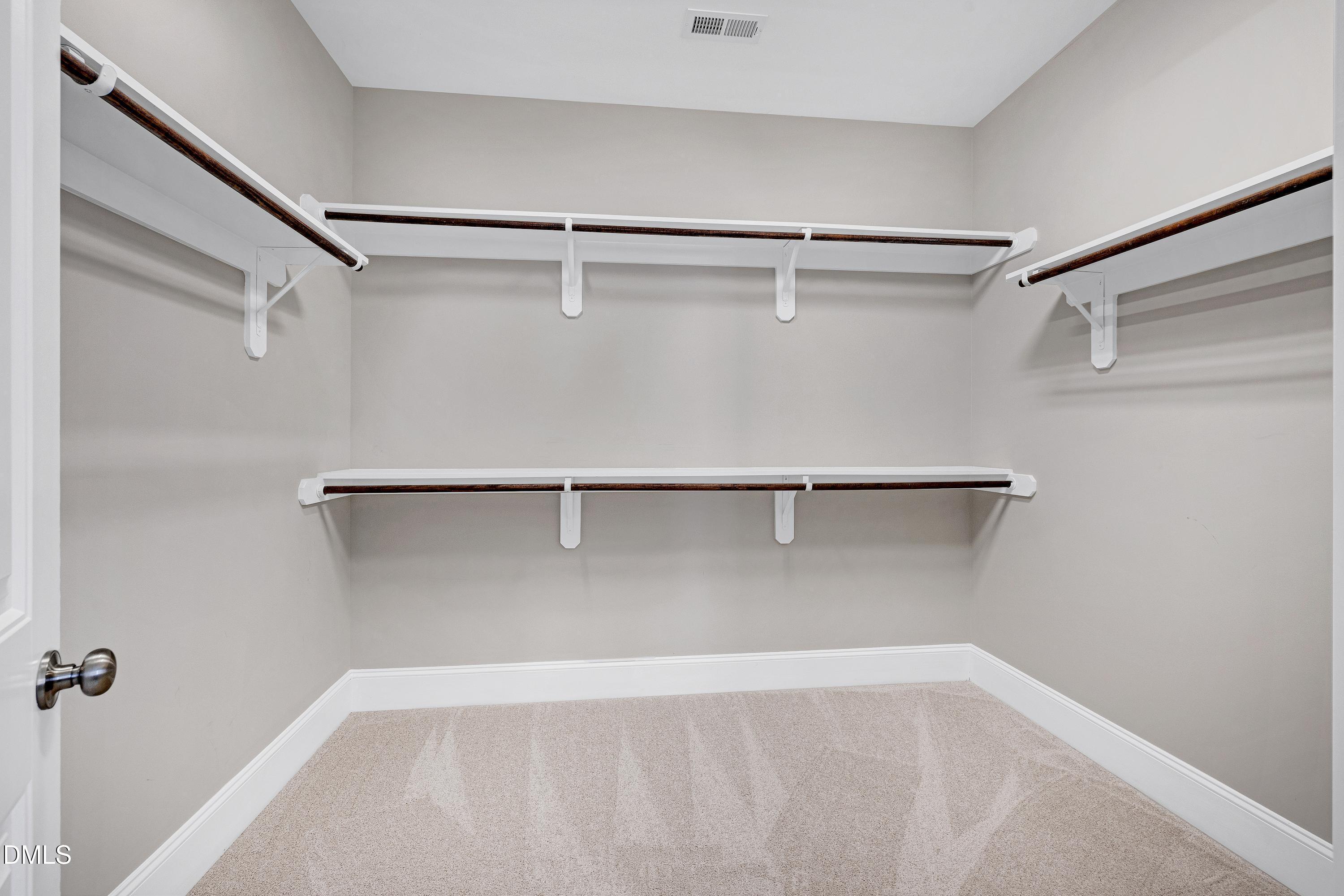 212 Mystic Pine Place Apex, NC 27539 - Photo 29 of 67 a view of a room with shelf on the wall