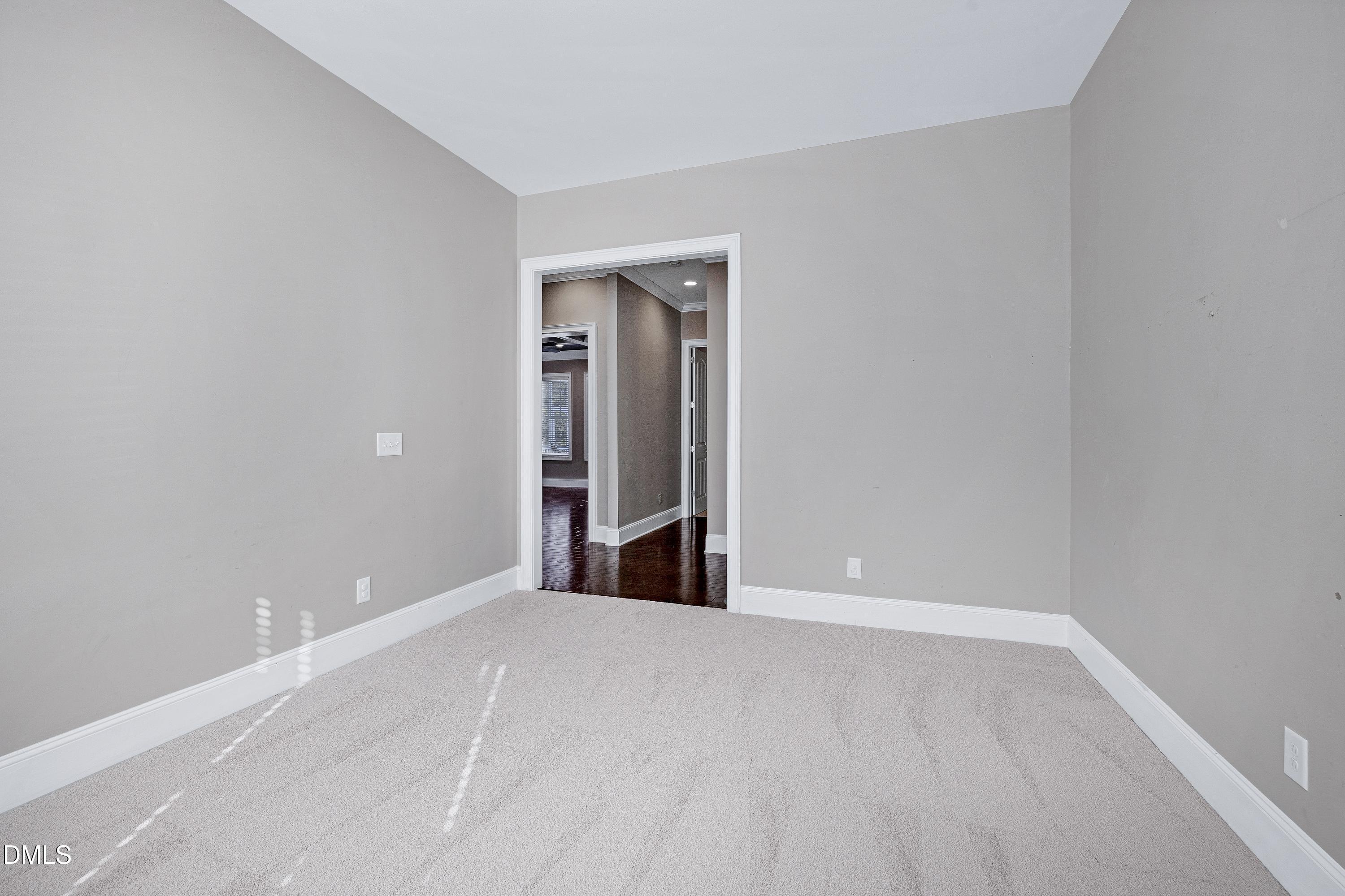 212 Mystic Pine Place Apex, NC 27539 - Photo 32 of 67 a view of an empty room with wooden floor