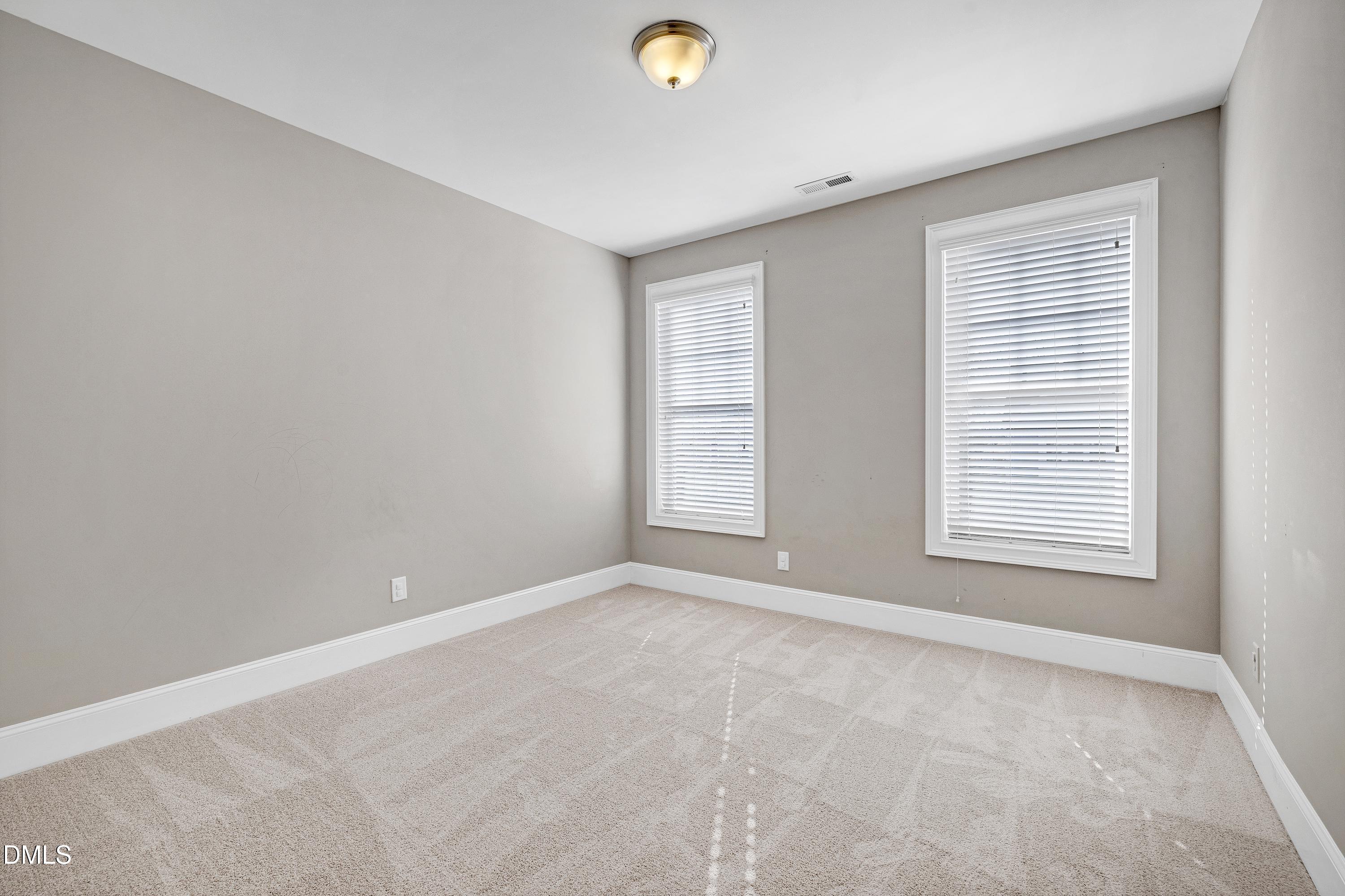 212 Mystic Pine Place Apex, NC 27539 - Photo 37 of 67 a view of an empty room with a window