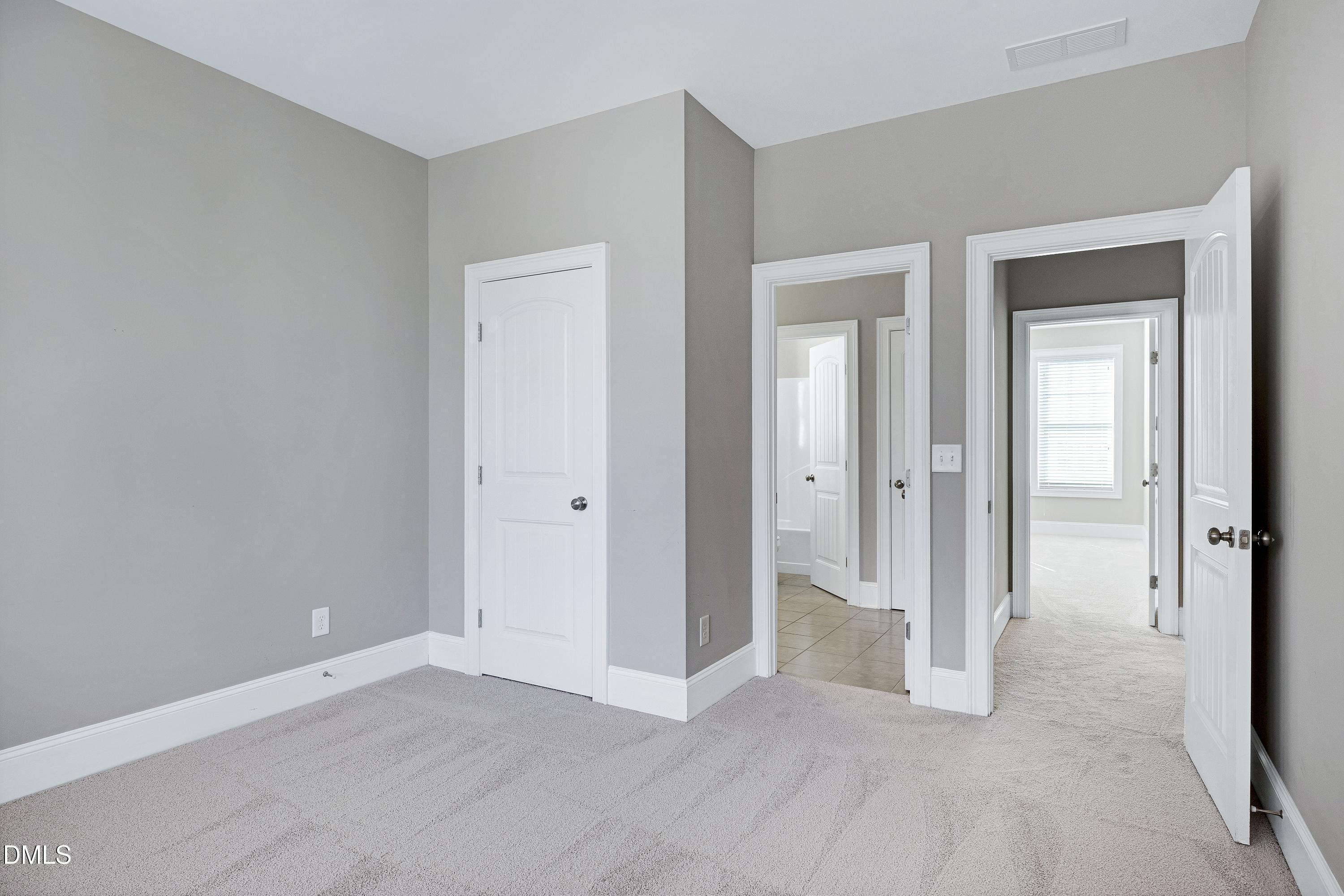 212 Mystic Pine Place Apex, NC 27539 - Photo 43 of 67 a view of an empty room with closet and a window