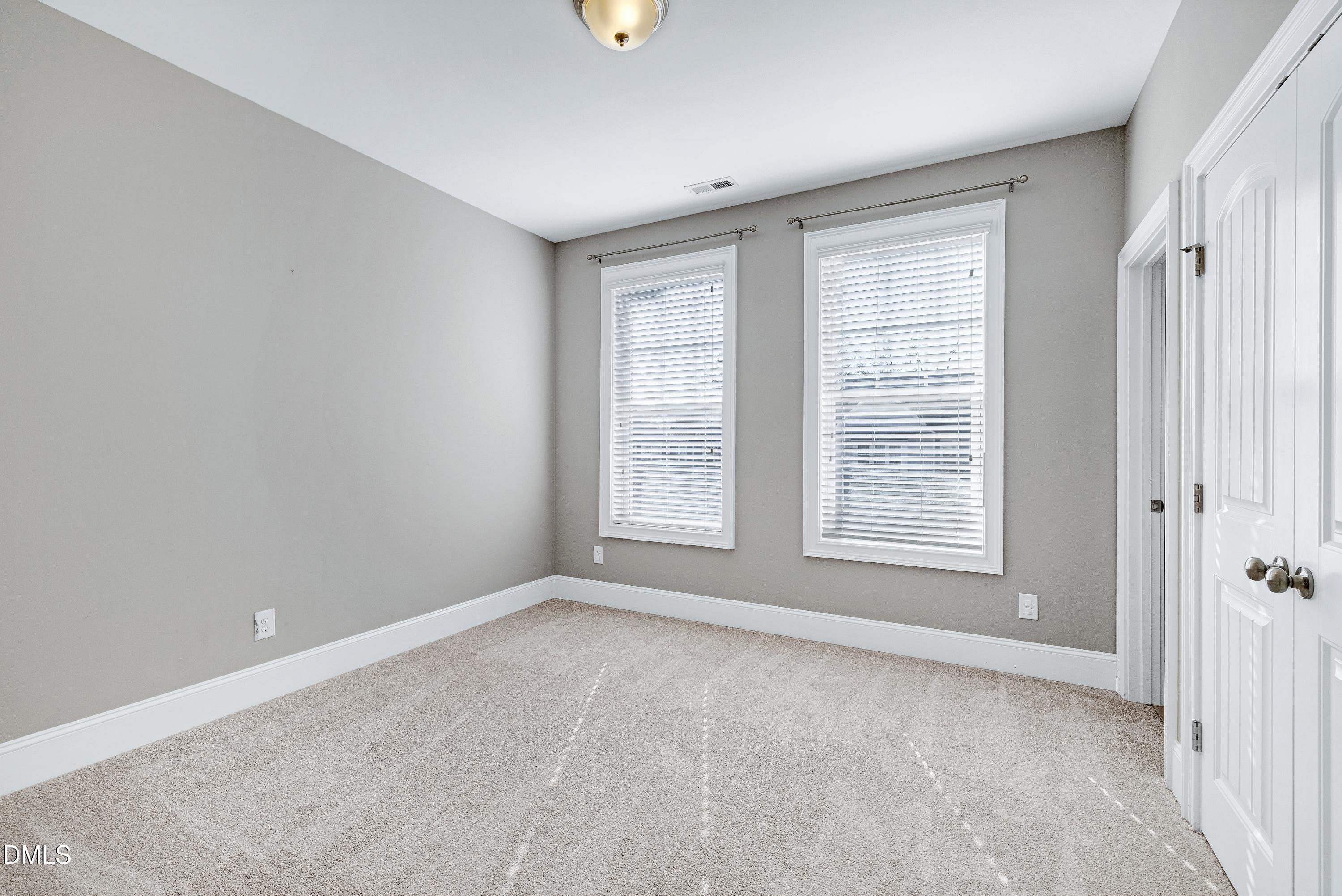 212 Mystic Pine Place Apex, NC 27539 - Photo 44 of 67 a view of an empty room with a window