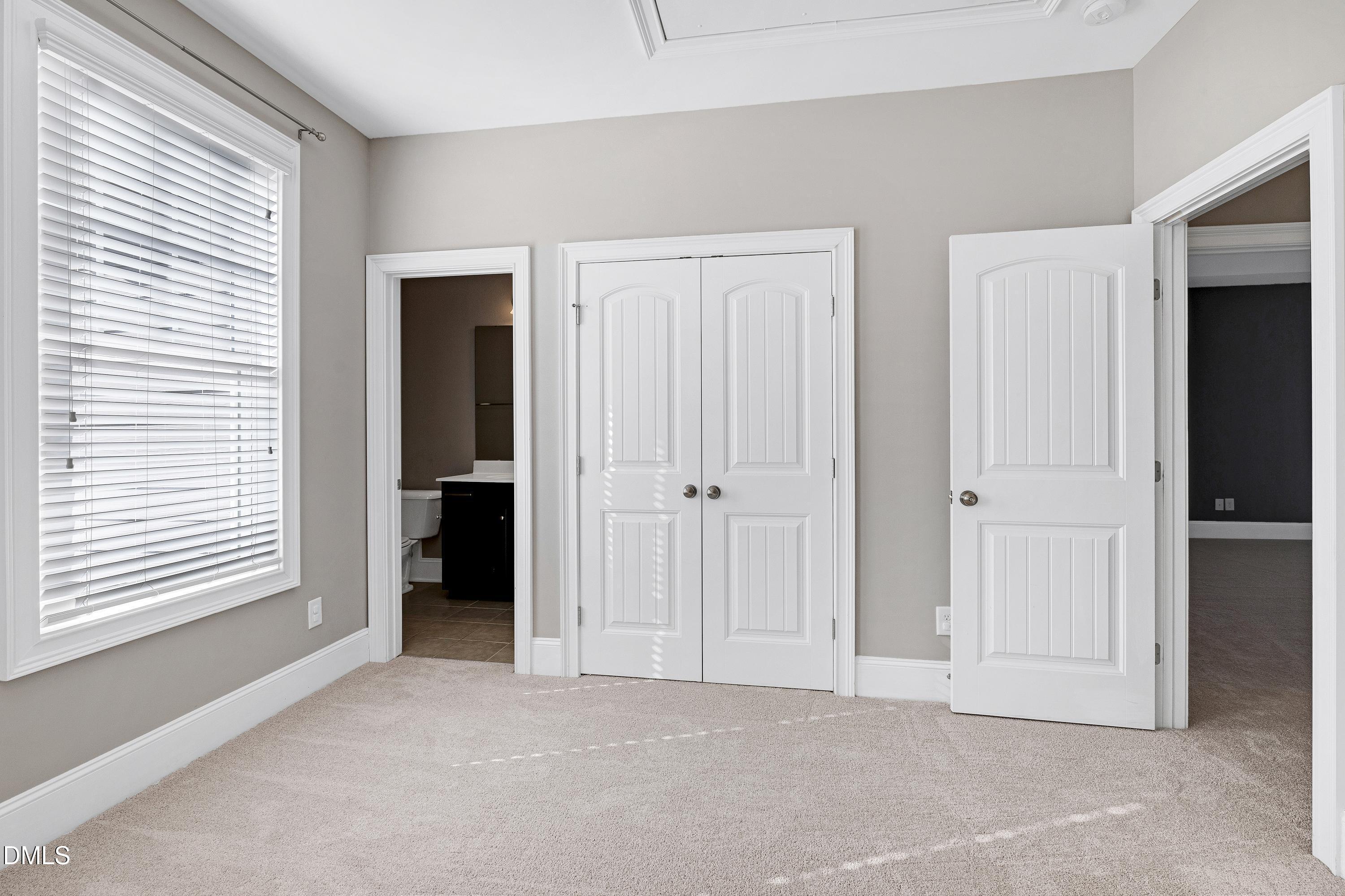 212 Mystic Pine Place Apex, NC 27539 - Photo 45 of 67 an empty room with windows and closet