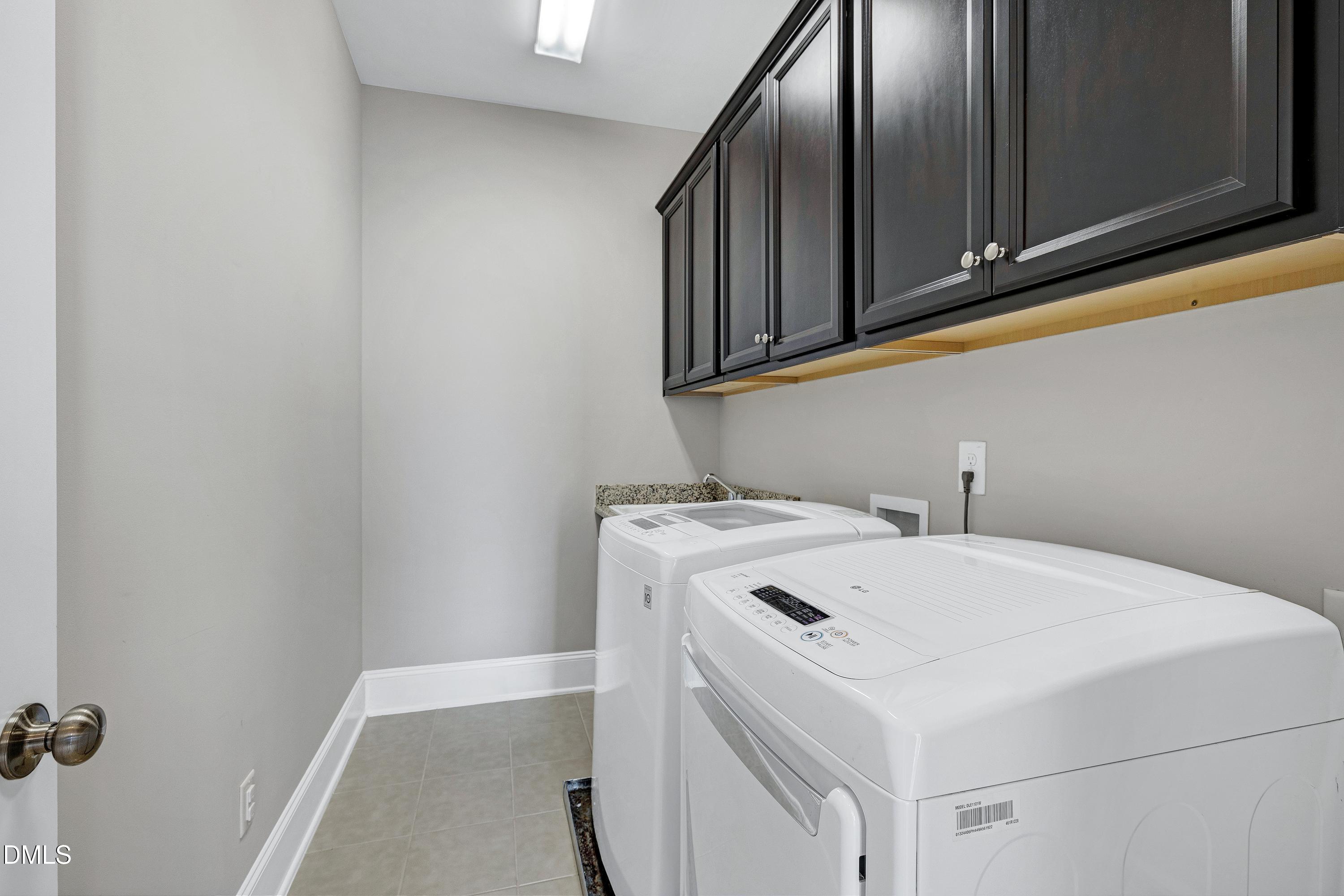212 Mystic Pine Place Apex, NC 27539 - Photo 47 of 67 a utility room with dryer and washer