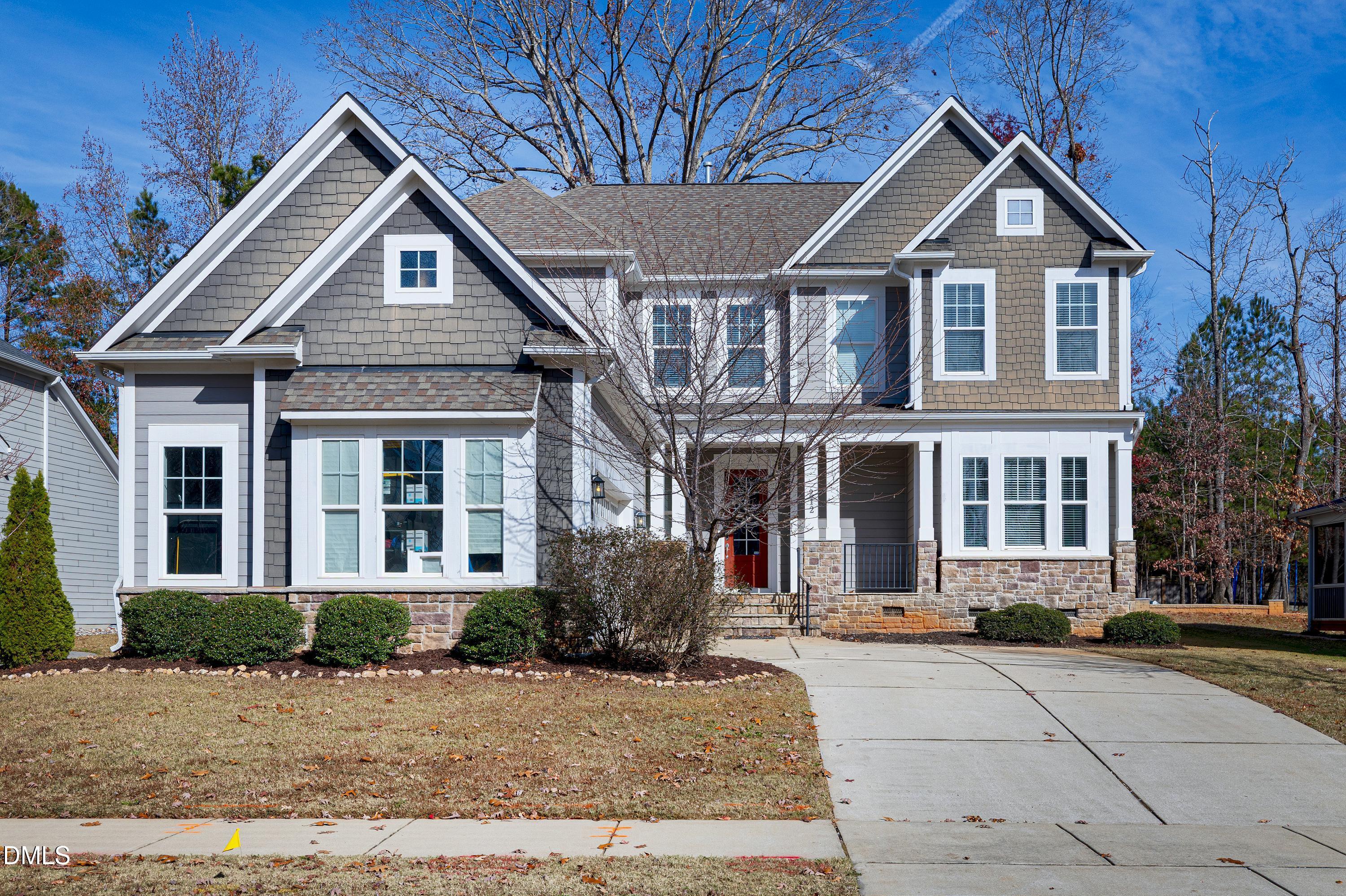 212 Mystic Pine Place Apex, NC 27539 - Photo 48 of 67 a front view of a house with a yard