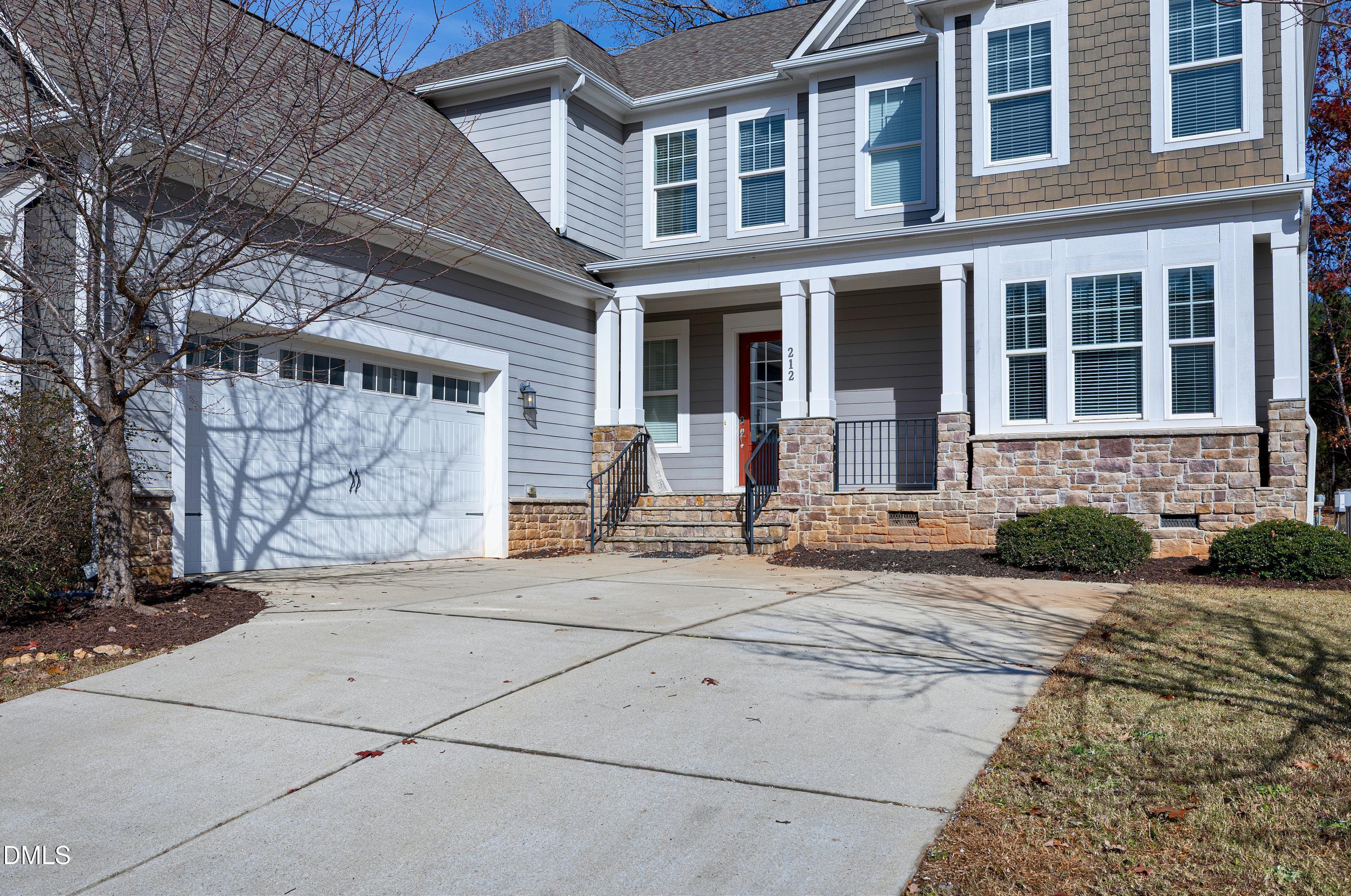 212 Mystic Pine Place Apex, NC 27539 - Photo 49 of 67 a front view of a house