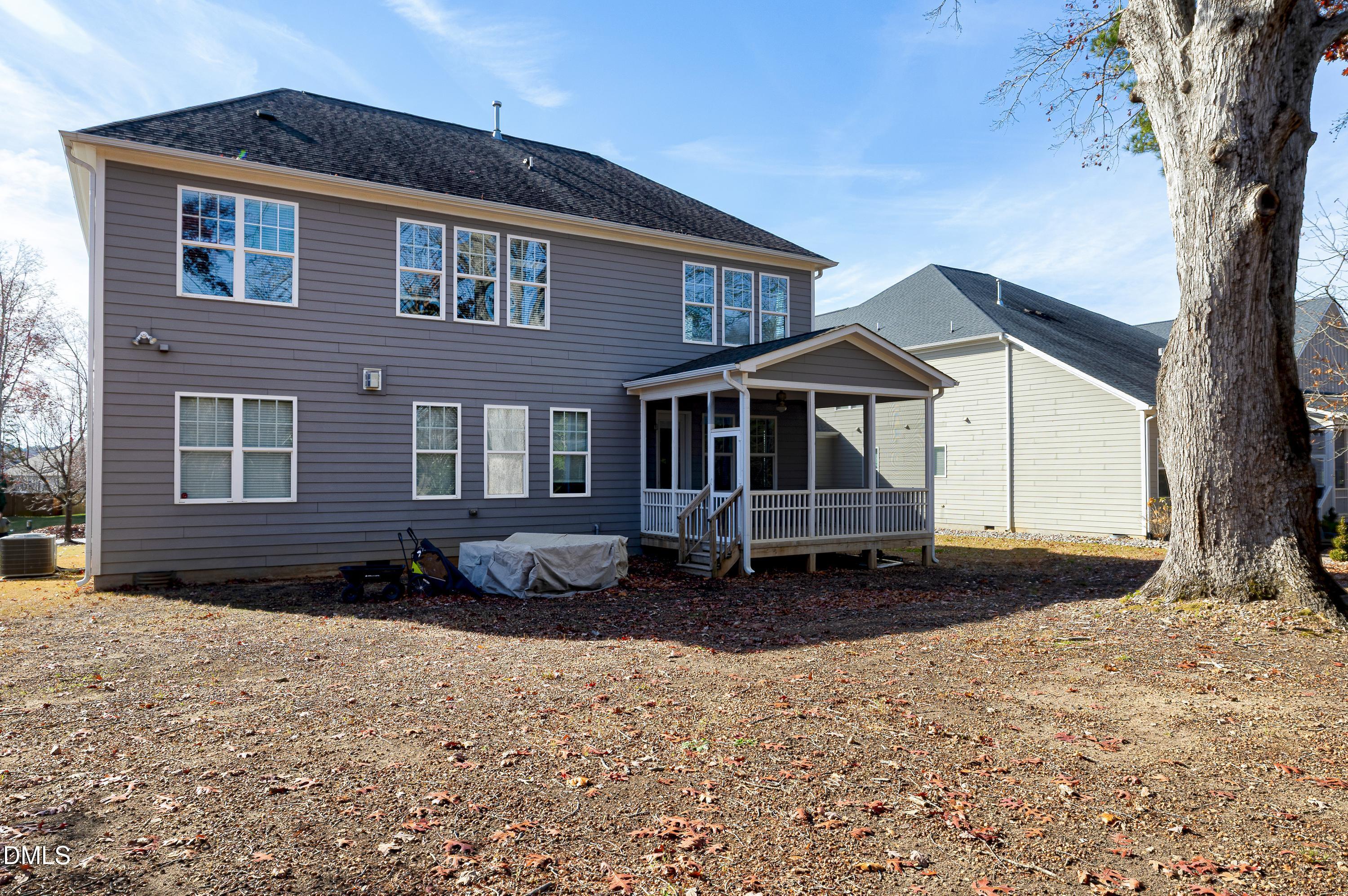212 Mystic Pine Place Apex, NC 27539 - Photo 51 of 67 a front view of a house with a yard covered in snow