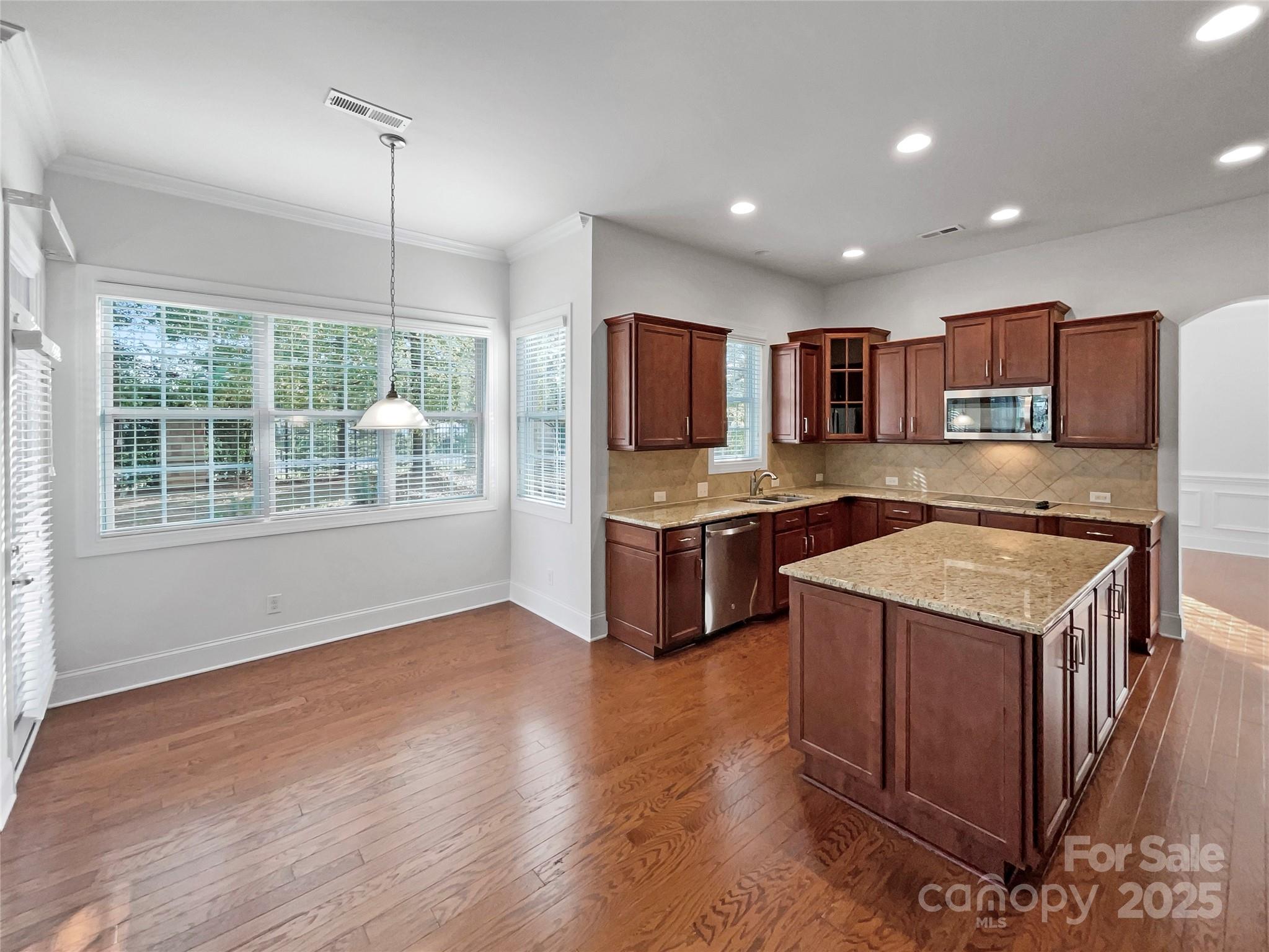 6615 Springs Mill Road Charlotte, NC 28277 - Photo 12 of 23 a kitchen with a stove a sink and a refrigerator
