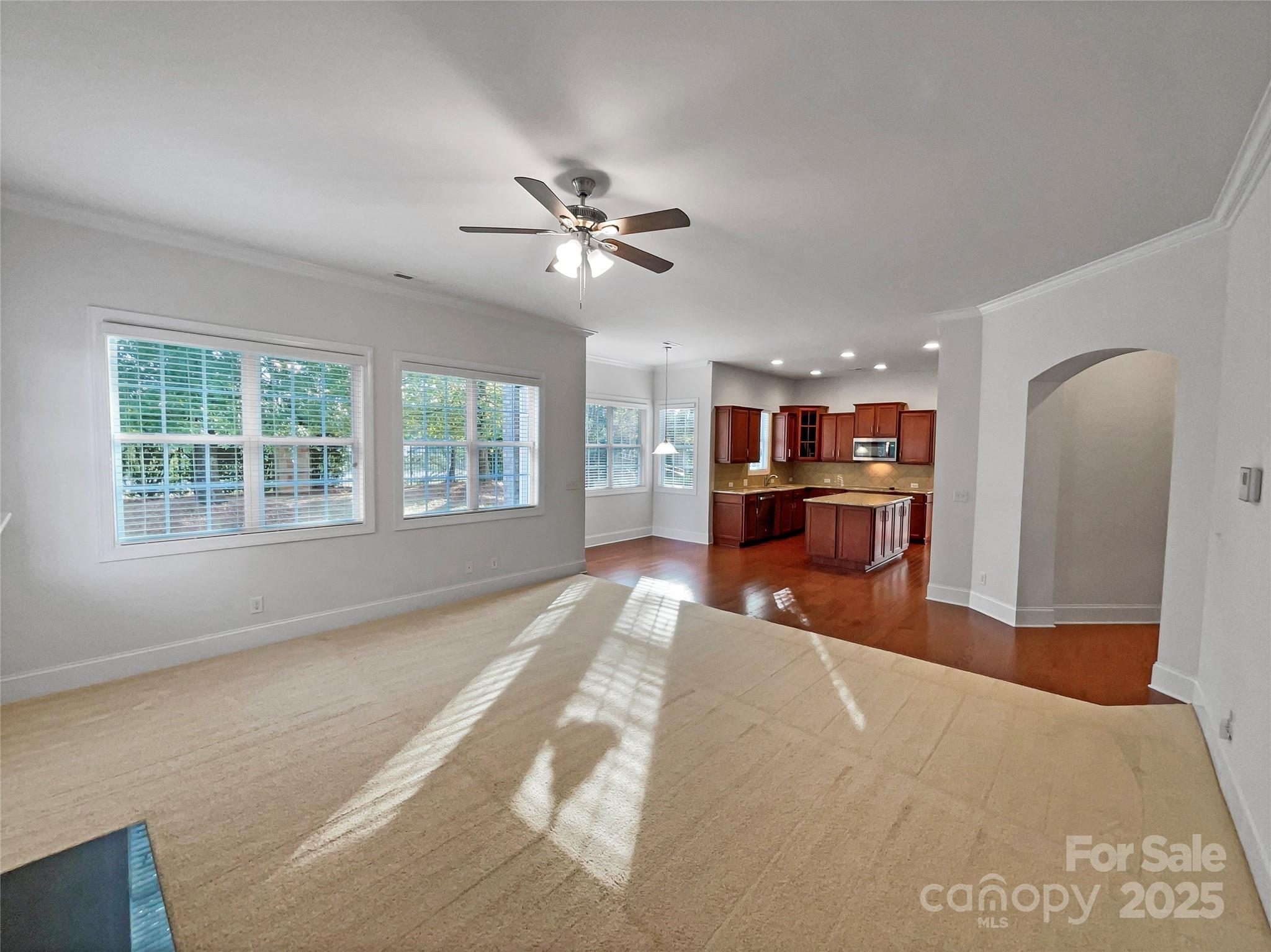 6615 Springs Mill Road Charlotte, NC 28277 - Photo 14 of 23 a living room with stainless steel appliances kitchen island furniture and a window