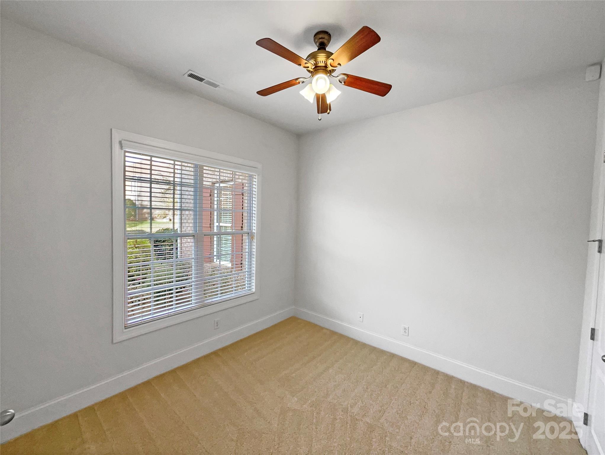 6615 Springs Mill Road Charlotte, NC 28277 - Photo 10 of 23 an empty room with a window