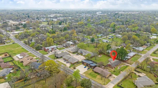 an aerial view of residential house with outdoor space and swimming pool