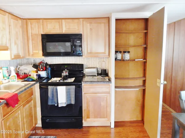 a kitchen with a refrigerator stove and a sink