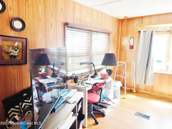 a work room with furniture and a window