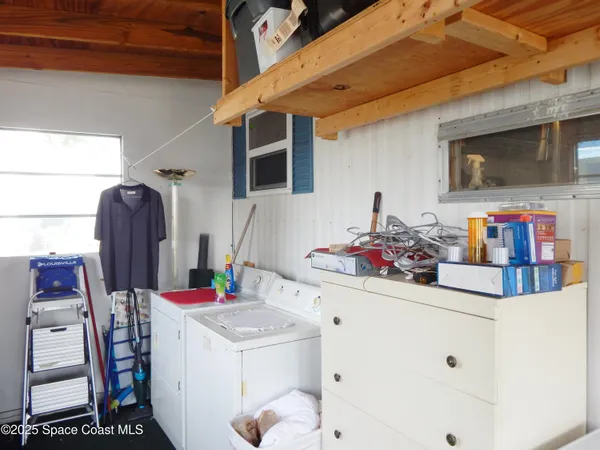 a bathroom with a sink mirror and cabinets