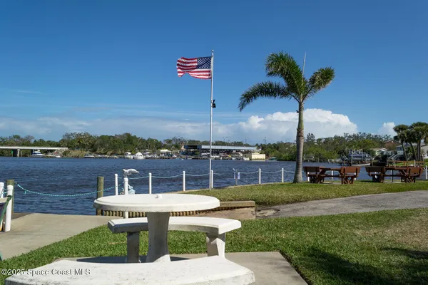 a view of a lake with houses in the back