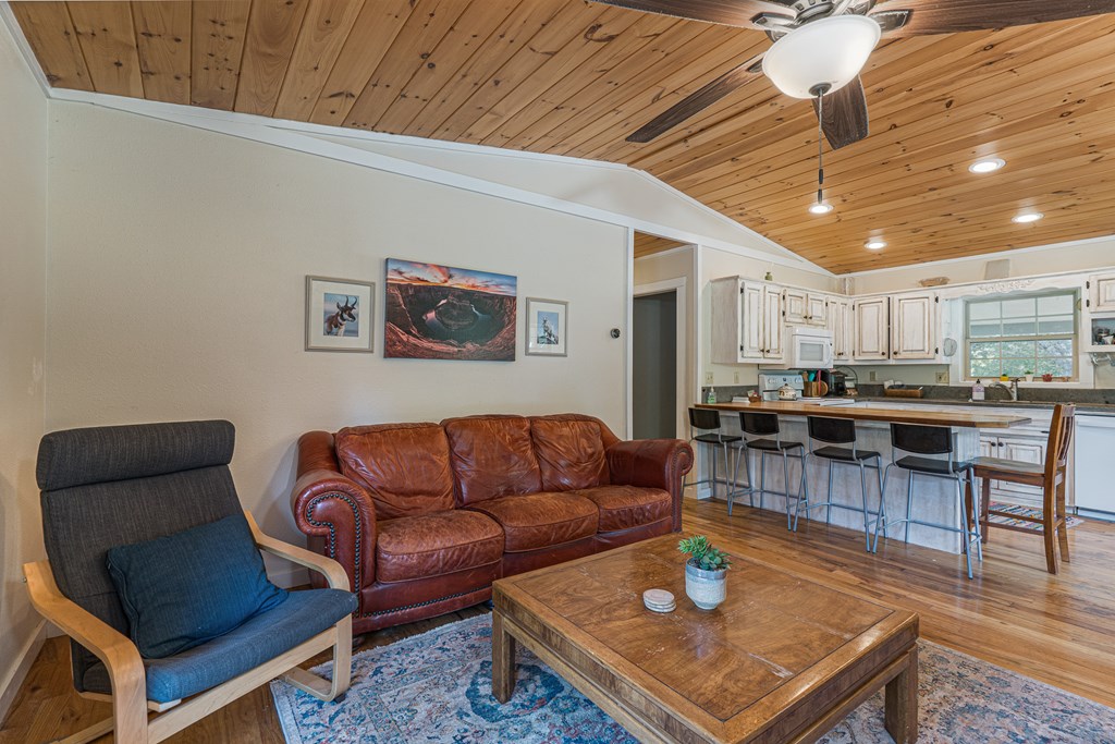 264 Tommy's Lane Murphy, NC 28906 - Photo 14 of 53 a living room with furniture a wooden floor and kitchen view