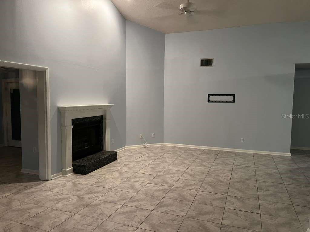 417 Greenfield Road Winter Haven, FL 33884 - Photo 9 of 15 a view of empty room with a fireplace