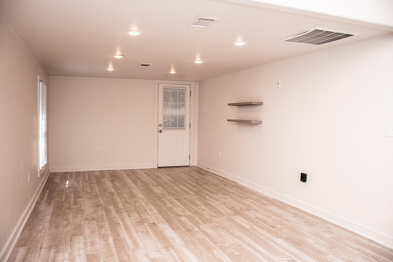 452 North Spring Street Crestview, FL 32536 - Photo 2 of 11 a view of hallway with a white wall