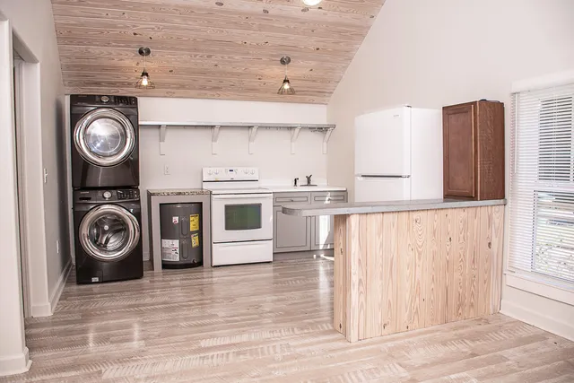 a kitchen with a stove and cabinets