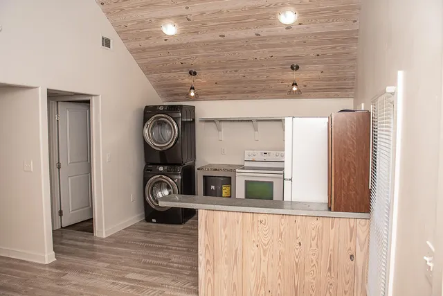 a view of a hallway with washer and dryer