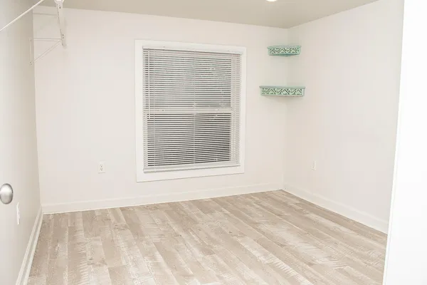 a view of an empty room with a window