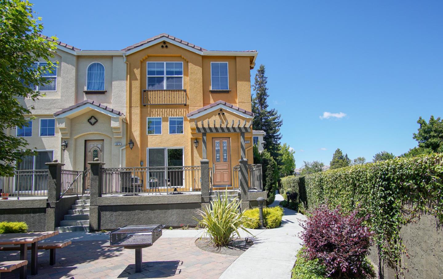 3906 Borgo Common Fremont, CA 94538 - Photo 1 of 21 a front view of a house with a yard
