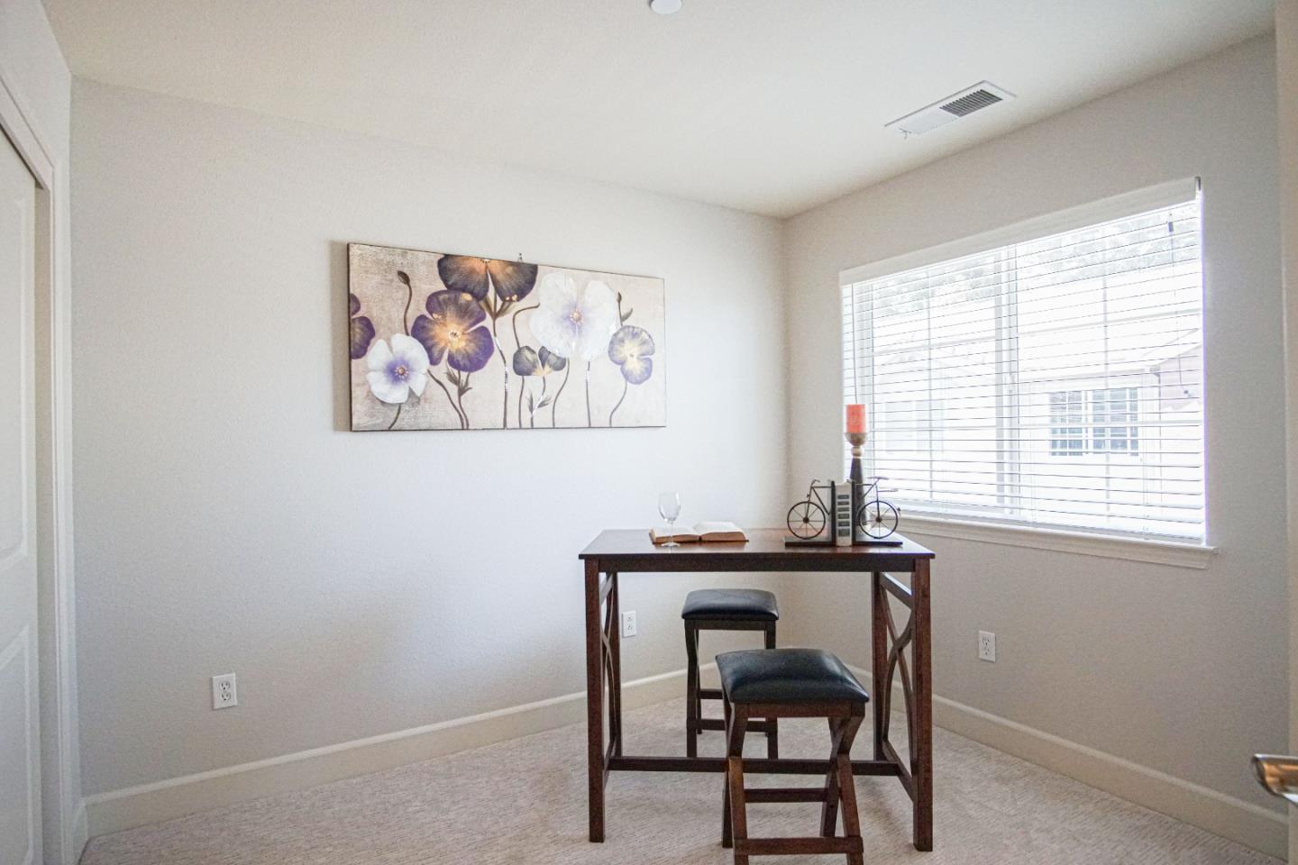 3906 Borgo Common Fremont, CA 94538 - Photo 13 of 21 a dining room with a table and chairs