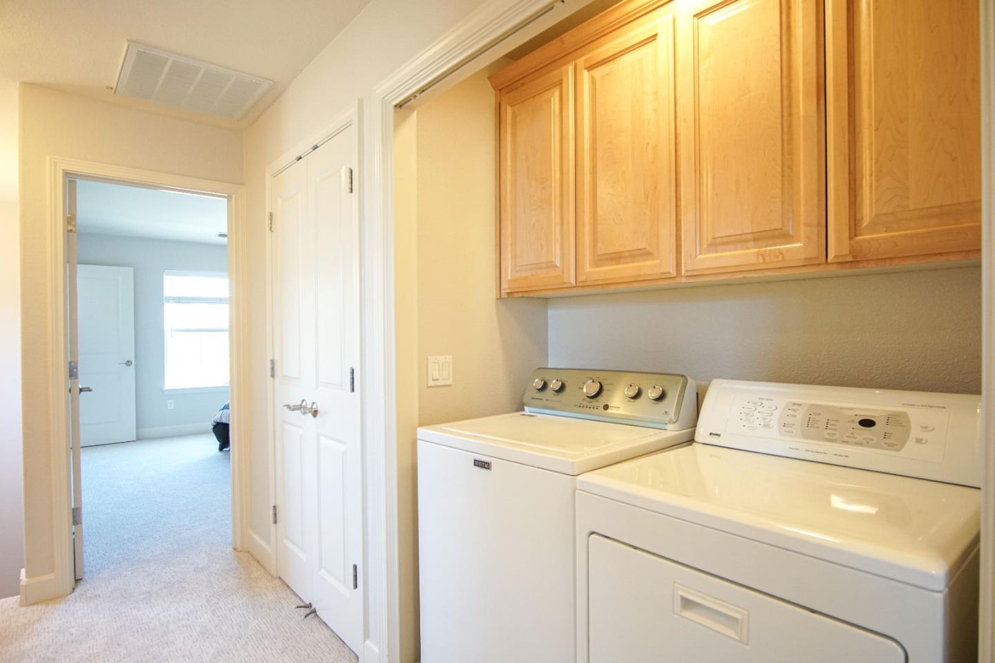 3906 Borgo Common Fremont, CA 94538 - Photo 17 of 21 a view of storage and utility room with washer and dryer