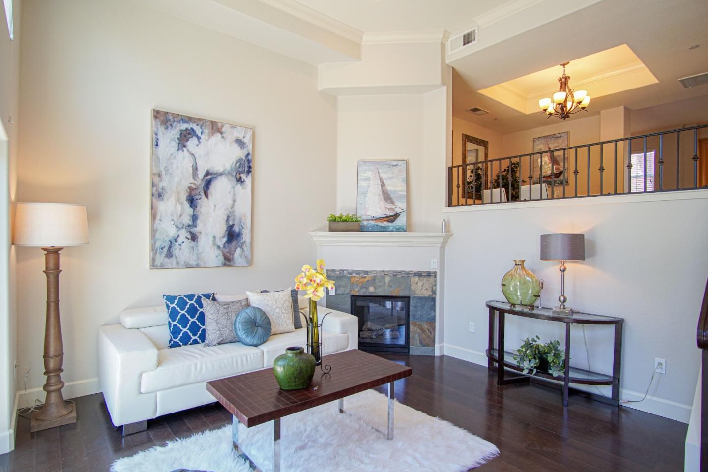 3906 Borgo Common Fremont, CA 94538 - Photo 3 of 21 a living room with furniture and a fireplace