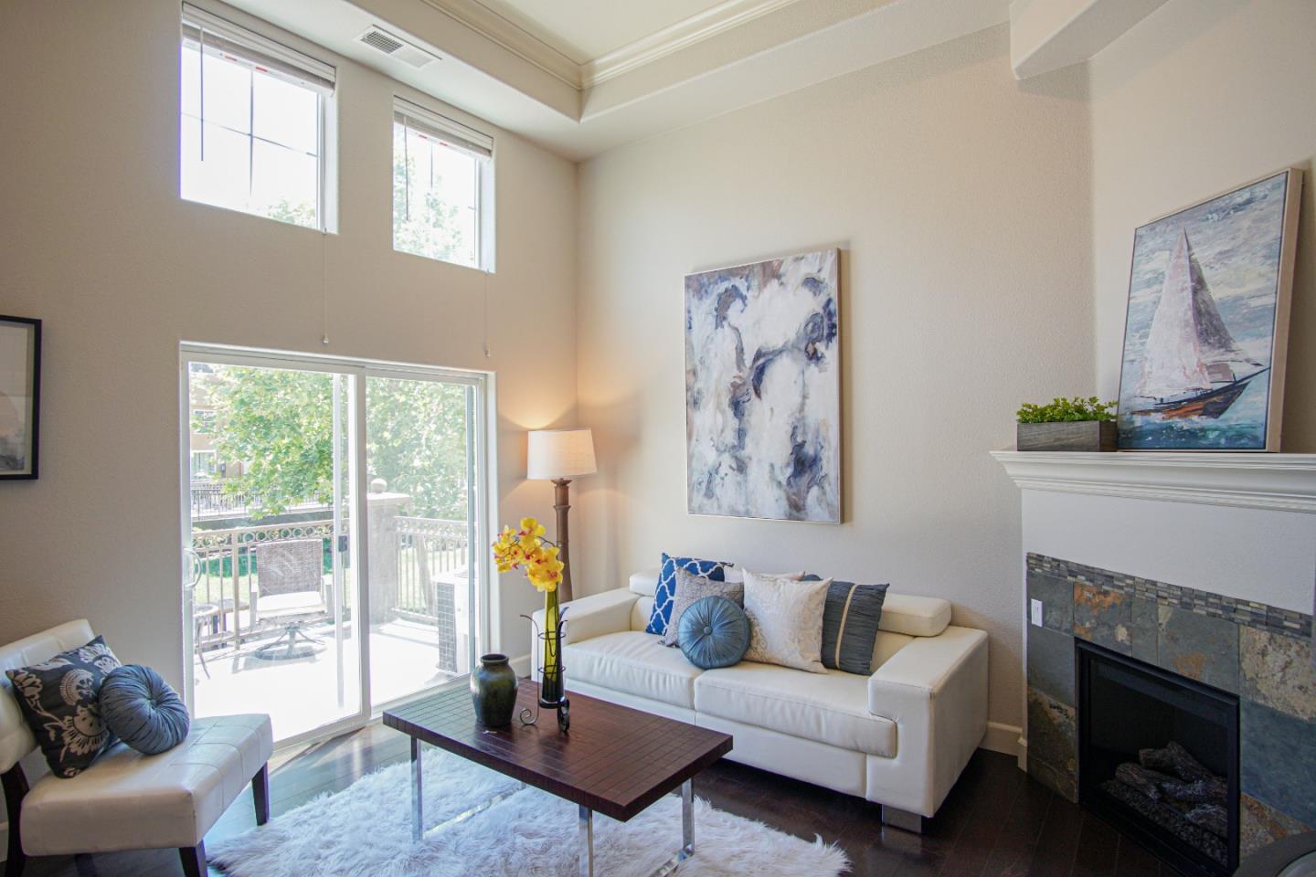3906 Borgo Common Fremont, CA 94538 - Photo 4 of 21 a living room with furniture and a fireplace