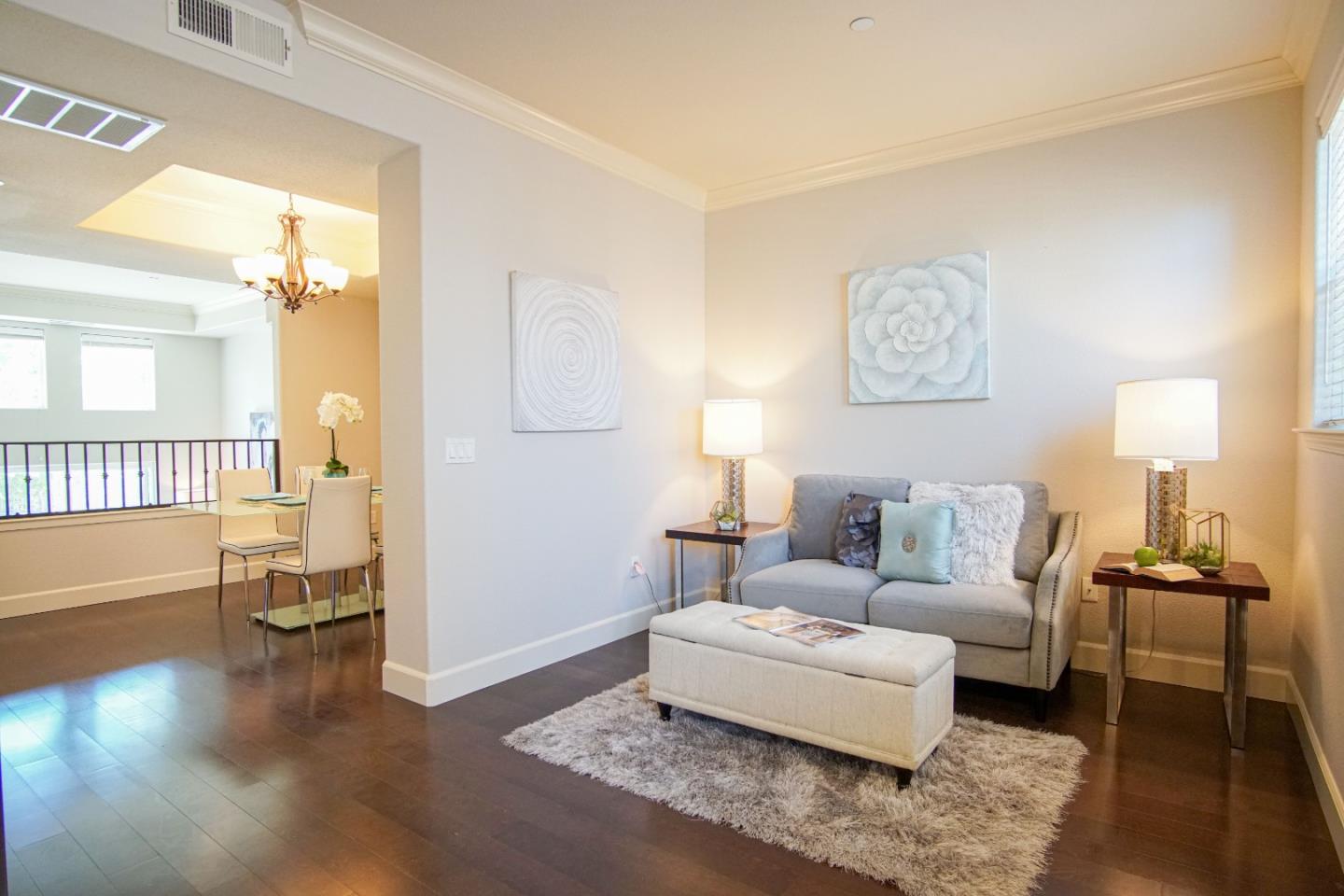 3906 Borgo Common Fremont, CA 94538 - Photo 6 of 21 a living room with furniture and a wooden floor