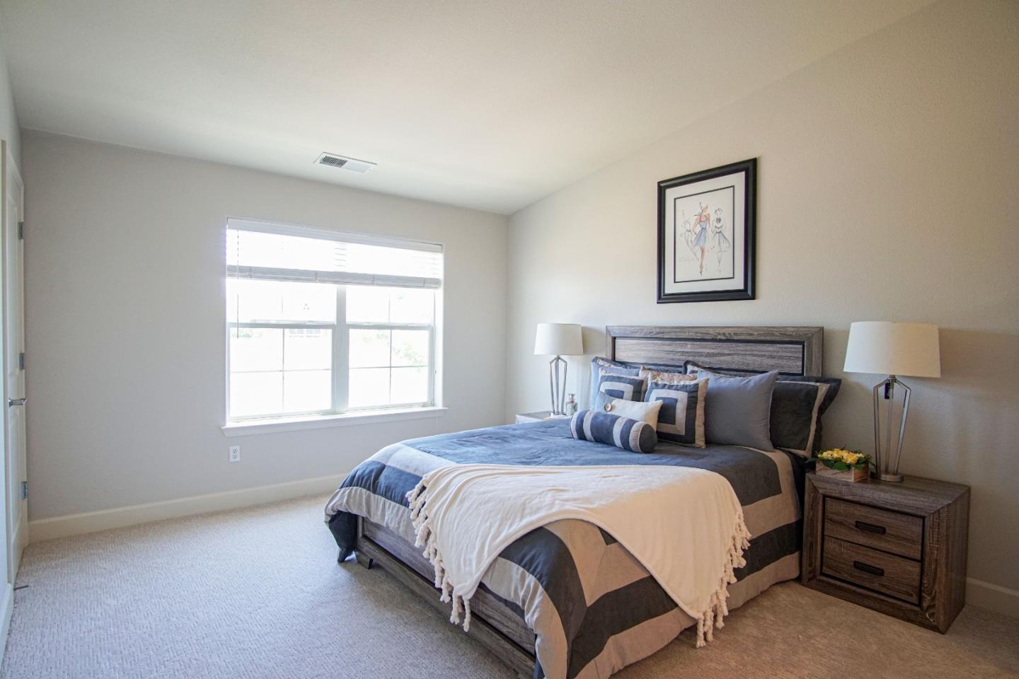 3906 Borgo Common Fremont, CA 94538 - Photo 10 of 21 a bedroom with a bed and a lamp
