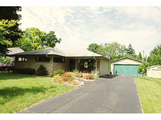 4224 Pinecrest Road Rockford, IL 61107 - Photo 1 of 11 a front view of a house with a yard and garage