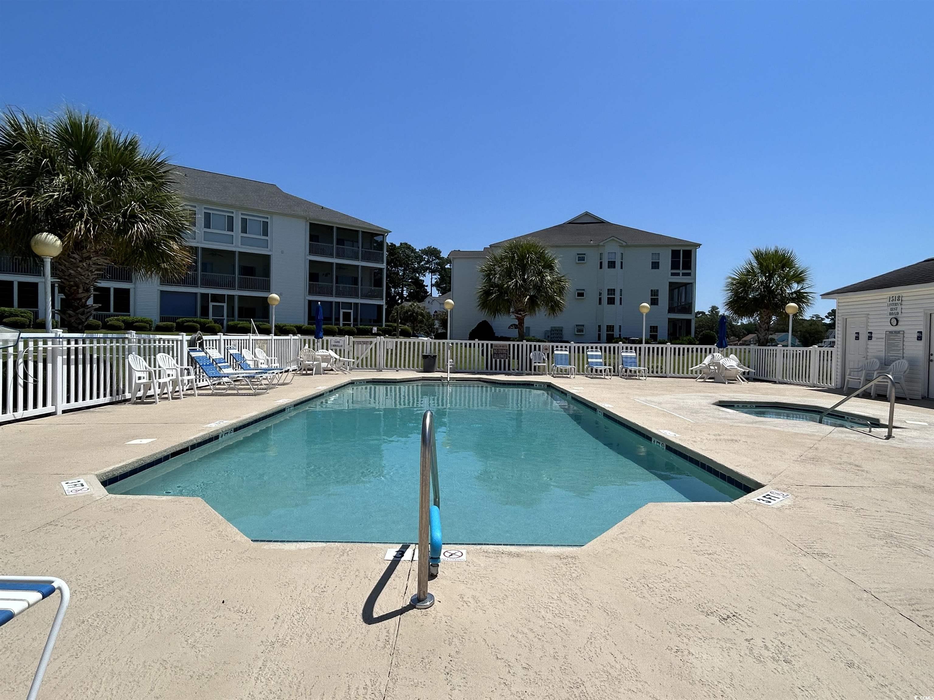 1525 Lanterns Rest Road, Unit 301 Myrtle Beach, SC 29579 - Photo 17 of 34 View of swimming pool with a patio