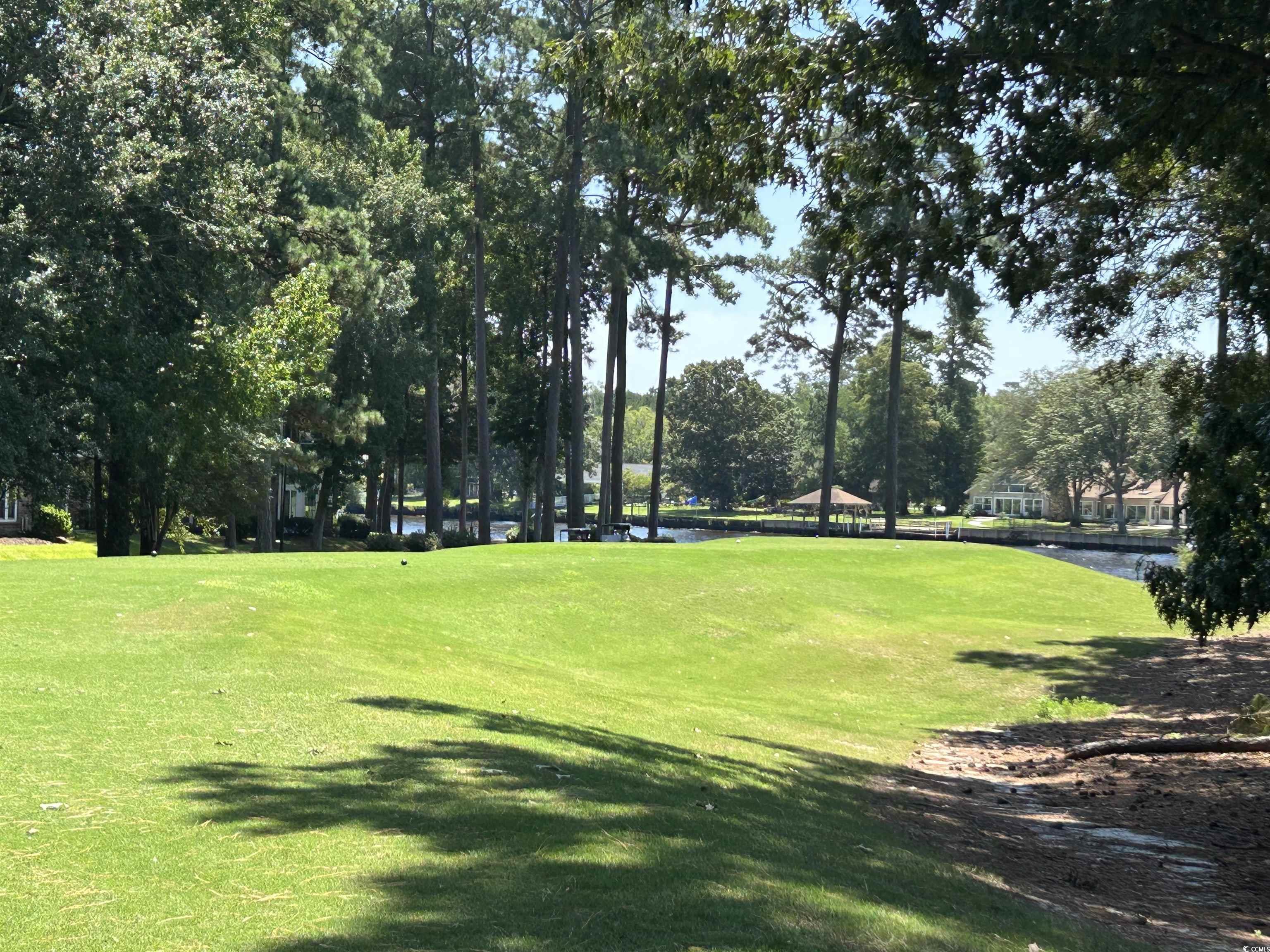 1525 Lanterns Rest Road, Unit 301 Myrtle Beach, SC 29579 - Photo 19 of 34 View of home's community with a lawn and a water view
