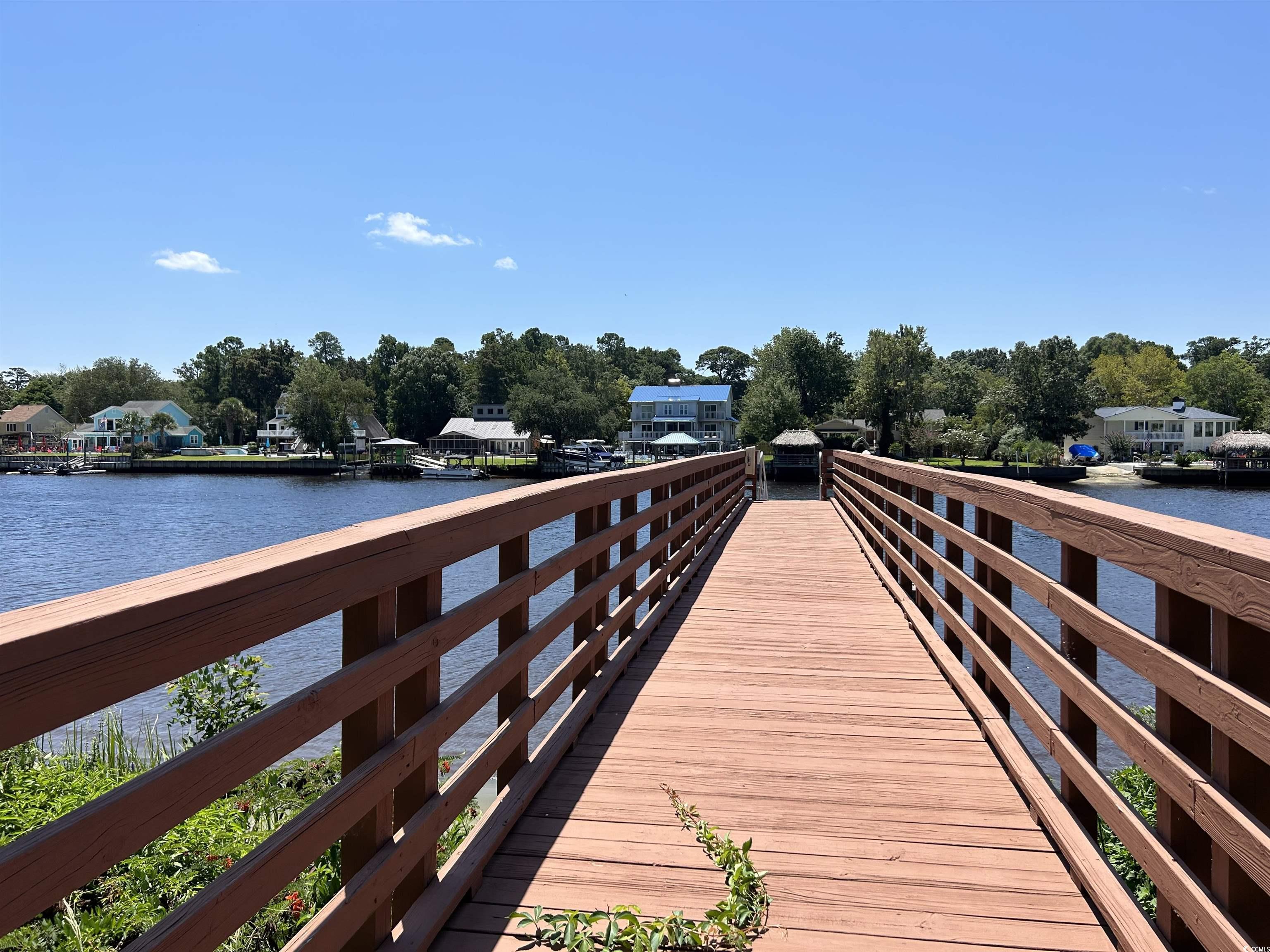 1525 Lanterns Rest Road, Unit 301 Myrtle Beach, SC 29579 - Photo 3 of 34 View of dock featuring a water view