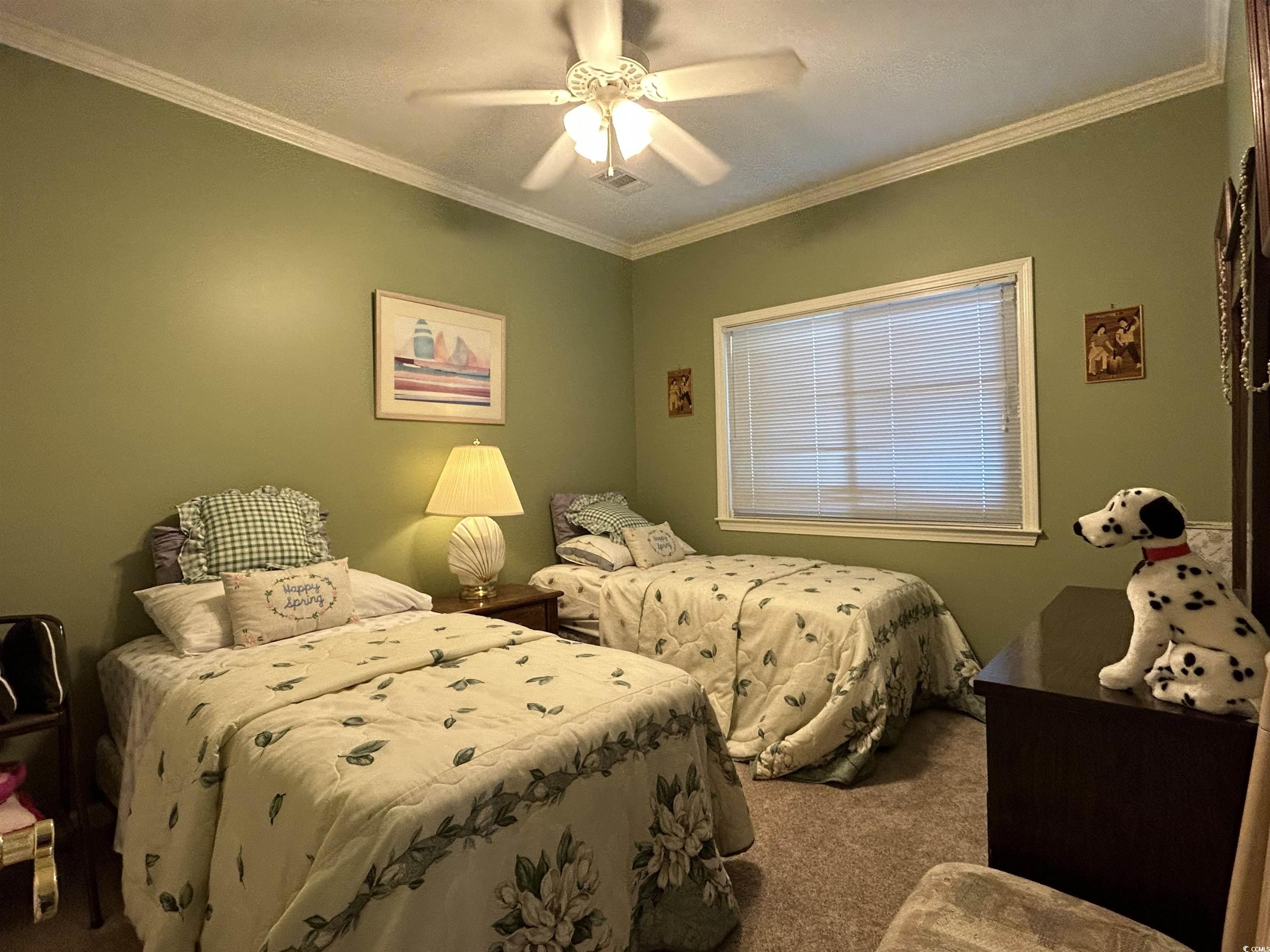 1525 Lanterns Rest Road, Unit 301 Myrtle Beach, SC 29579 - Photo 10 of 34 Carpeted bedroom with ceiling fan and ornamental molding