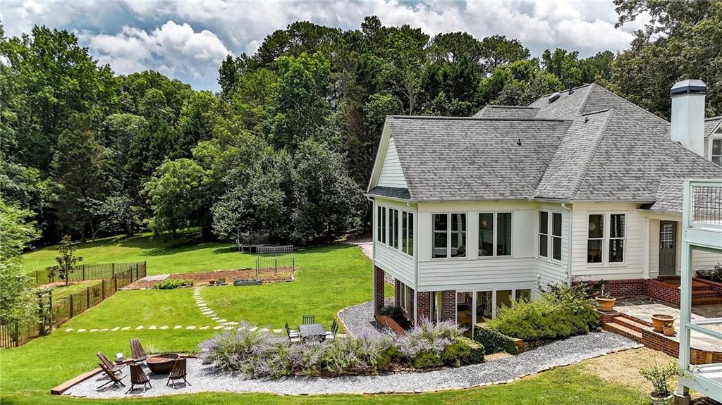 548 Tamarack Trail Canton, GA 30115 - Photo 16 of 83 an aerial view of a house with a yard table and chairs