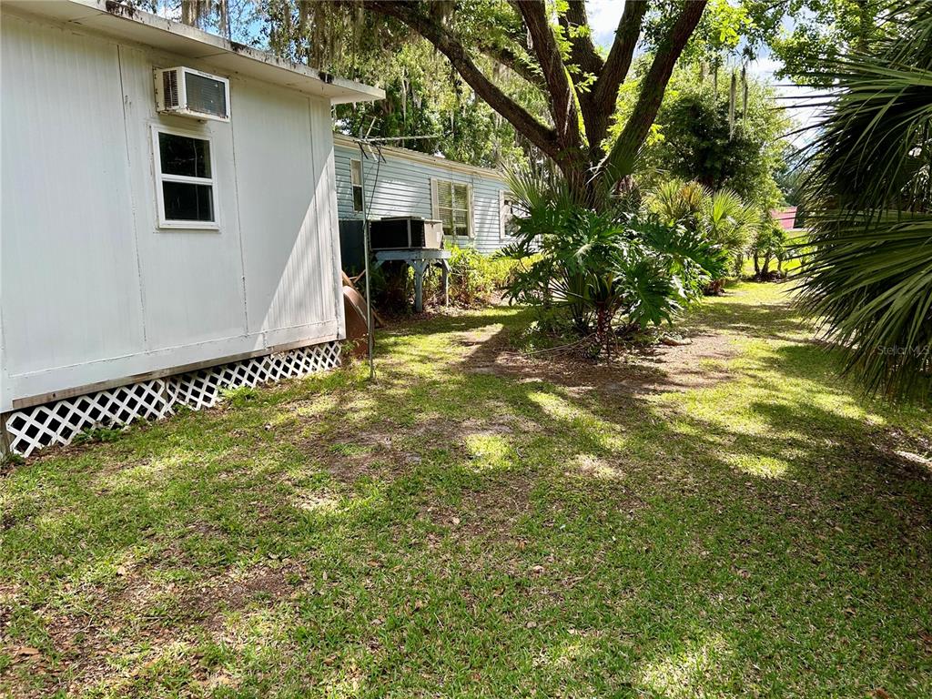 25646 Bass Road Astor, FL 32102 - Photo 46 of 48 a view of a house with a yard