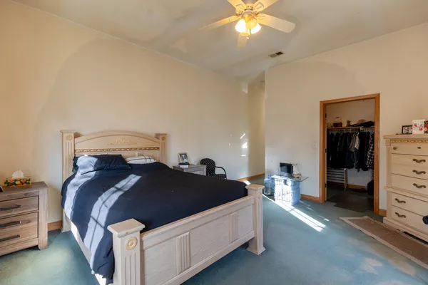 a bed room with a bed and a lamp