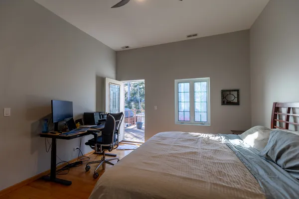 a bedroom with a workspace