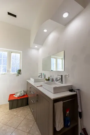 a kitchen with a sink and cabinets