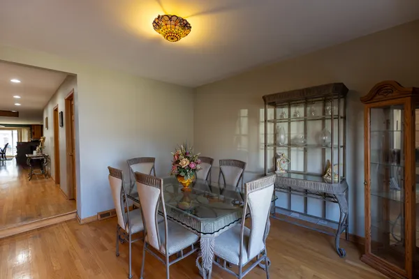 a dining room with furniture and window