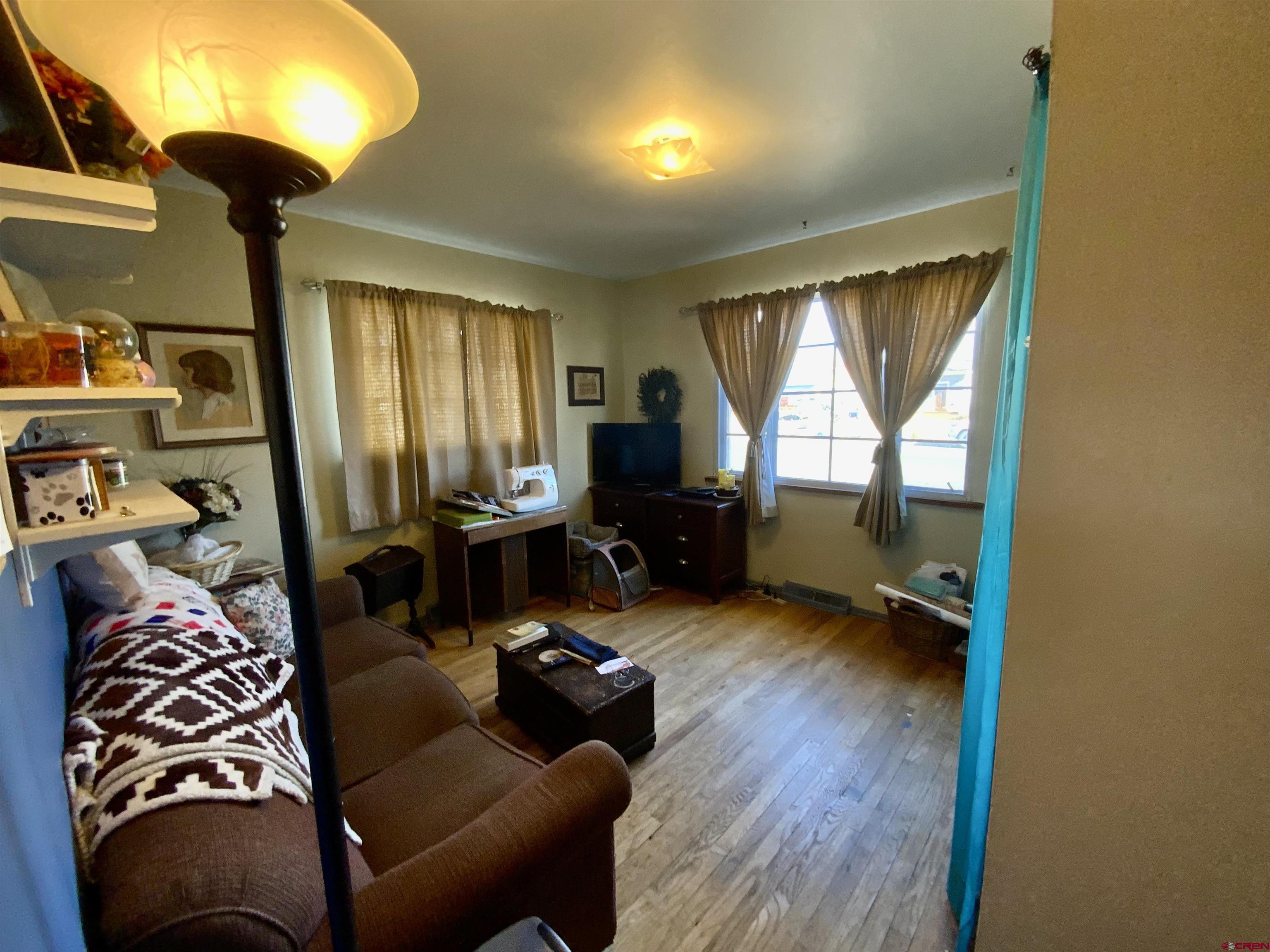 21 Vulcan Street Gunnison, CO 81230 - Photo 12 of 21 a living room with furniture and a window