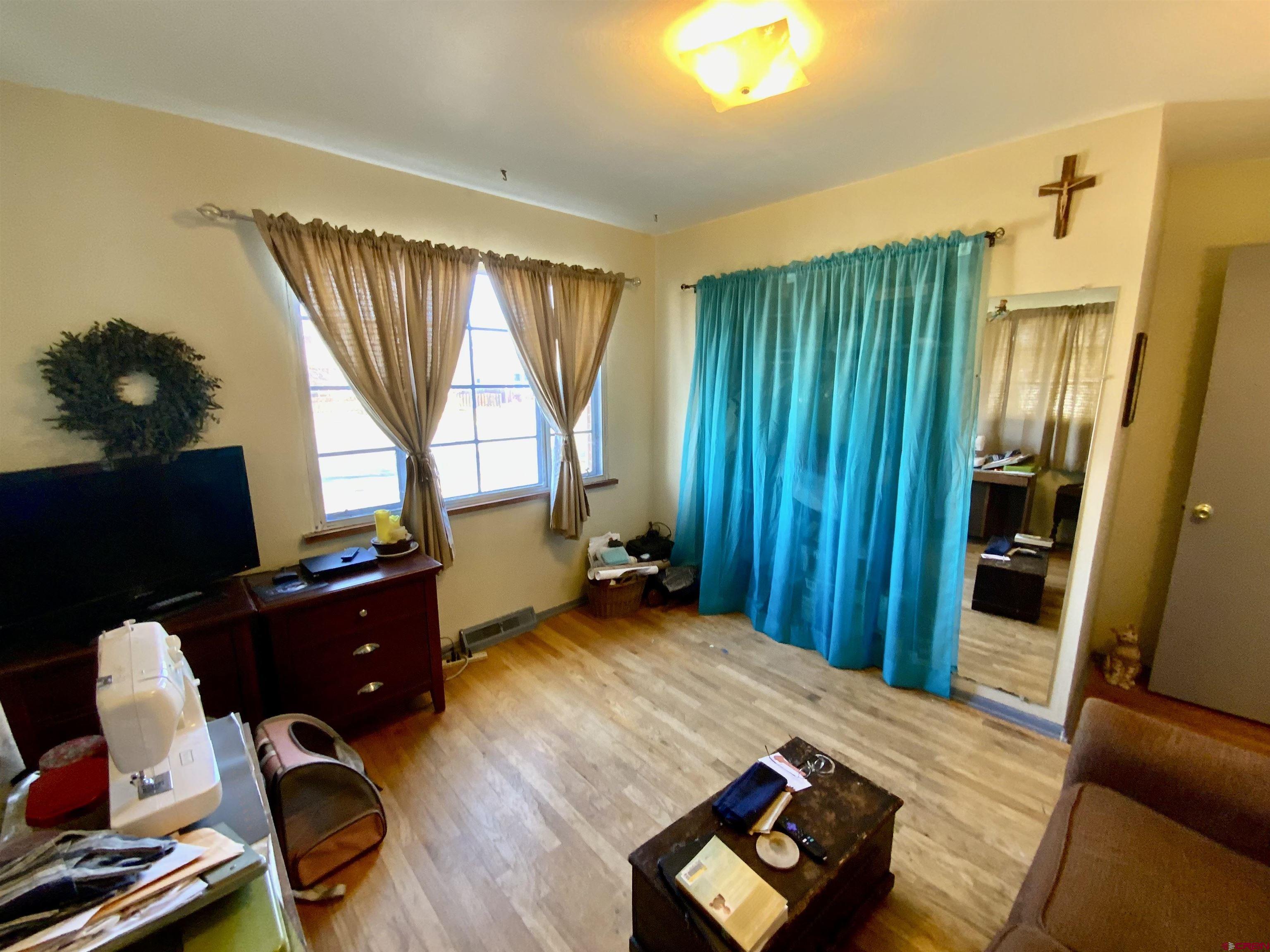 21 Vulcan Street Gunnison, CO 81230 - Photo 13 of 21 a room with furniture and a window