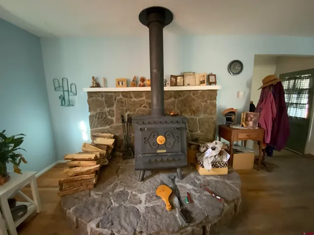 a bed room with furniture and a fireplace