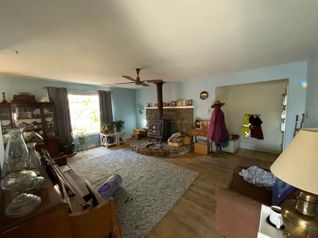 a room with furniture gym equipment and view of living room