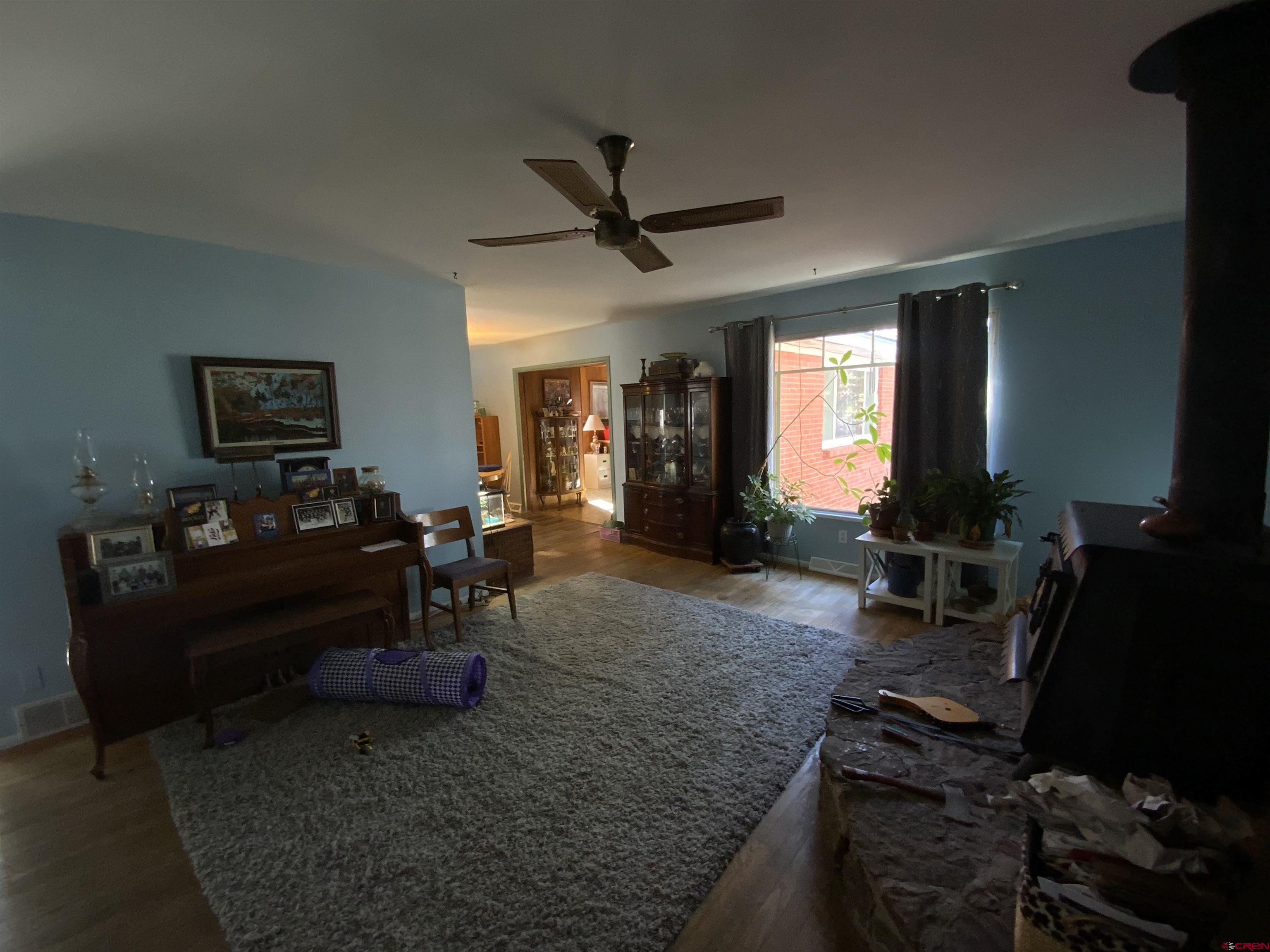 21 Vulcan Street Gunnison, CO 81230 - Photo 20 of 21 a living room with furniture and a window